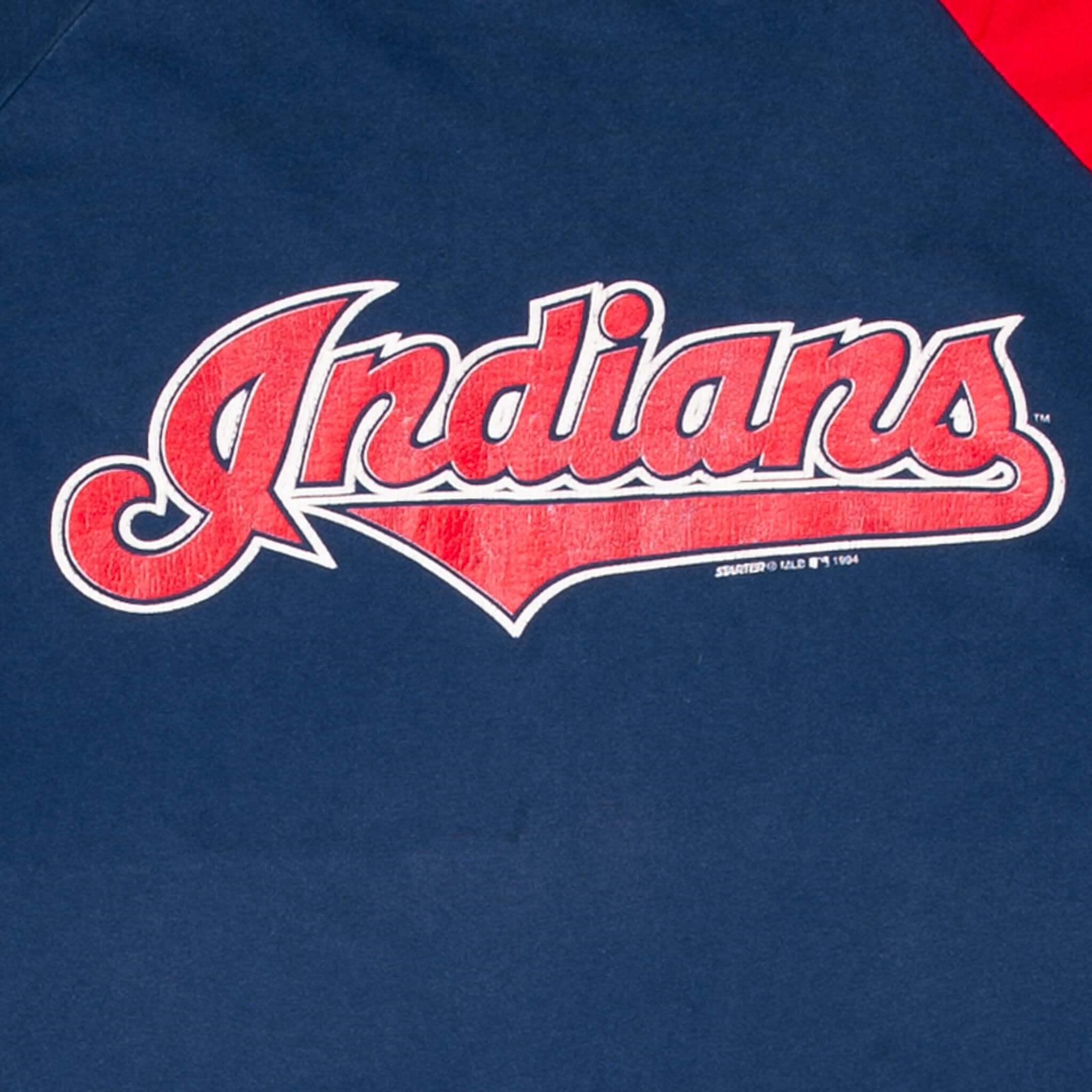 Close-up of red and white Cleveland Indians script chest print on navy fabric