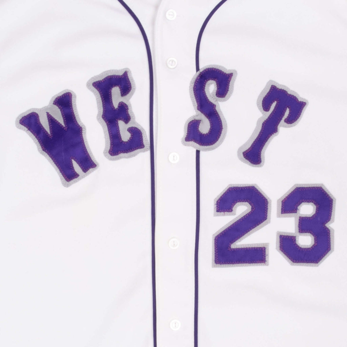 Close-up of purple WEST lettering and number 23 on jersey front