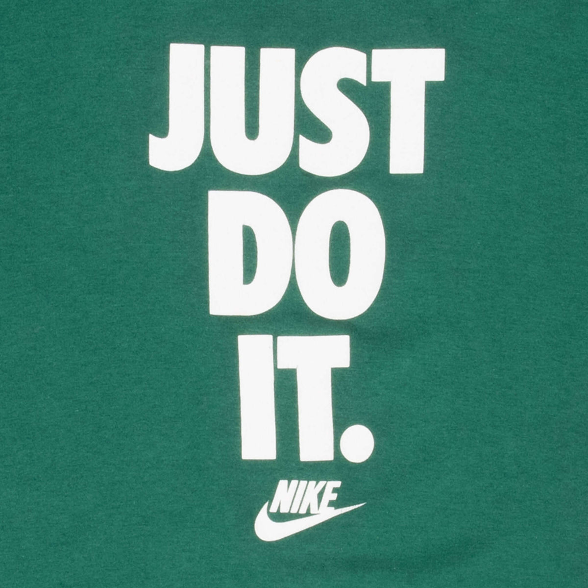 Close-up of white Just Do It text and Nike Swoosh print on green T-shirt