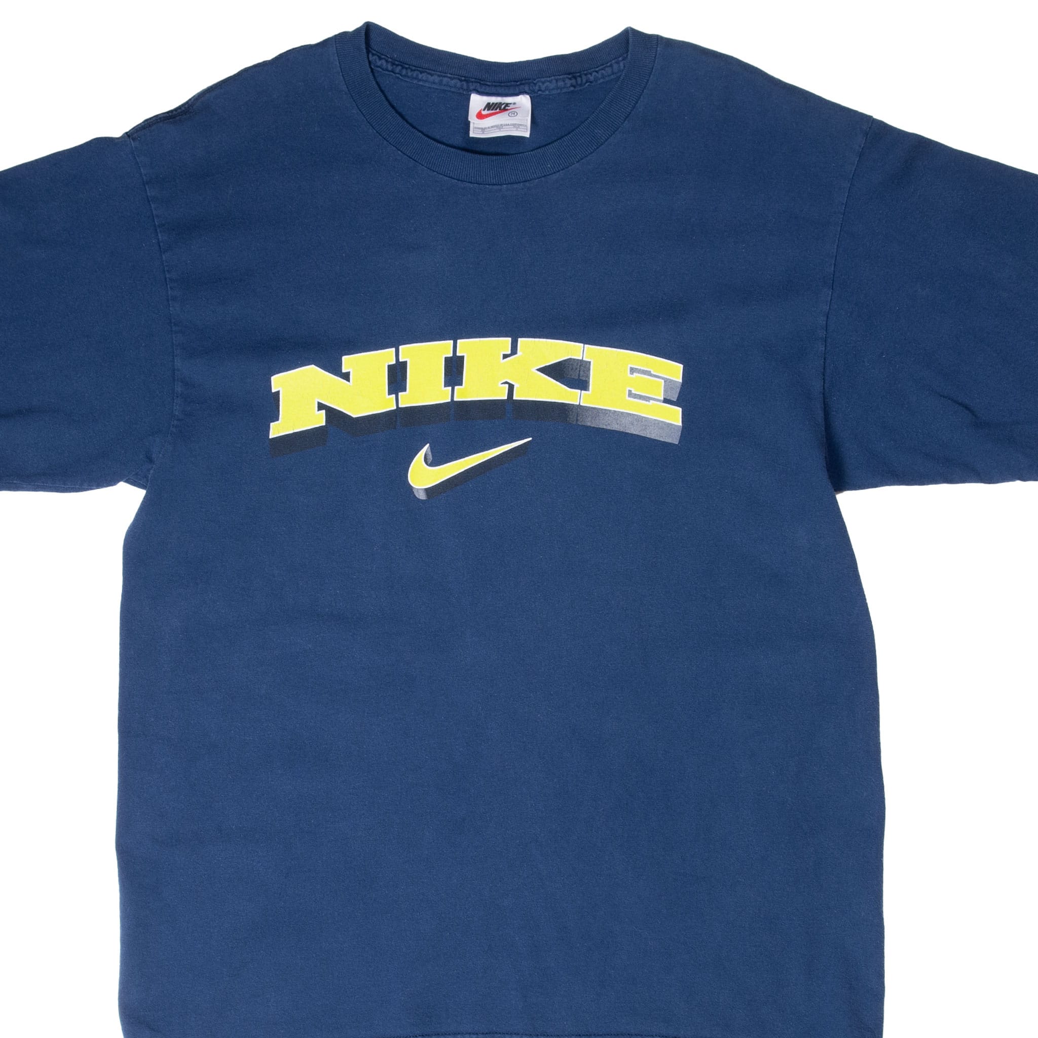 Upper front of blue Nike T-shirt with arched yellow spellout and Swoosh graphic