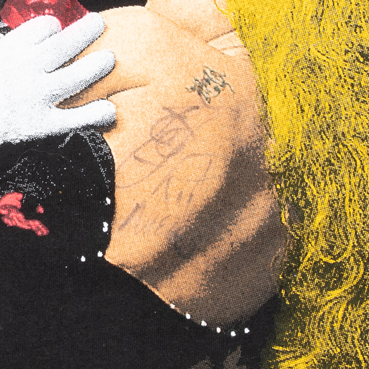 Close-up of Rick Nielsen signature on the front graphic of the Cheap Trick T-shirt