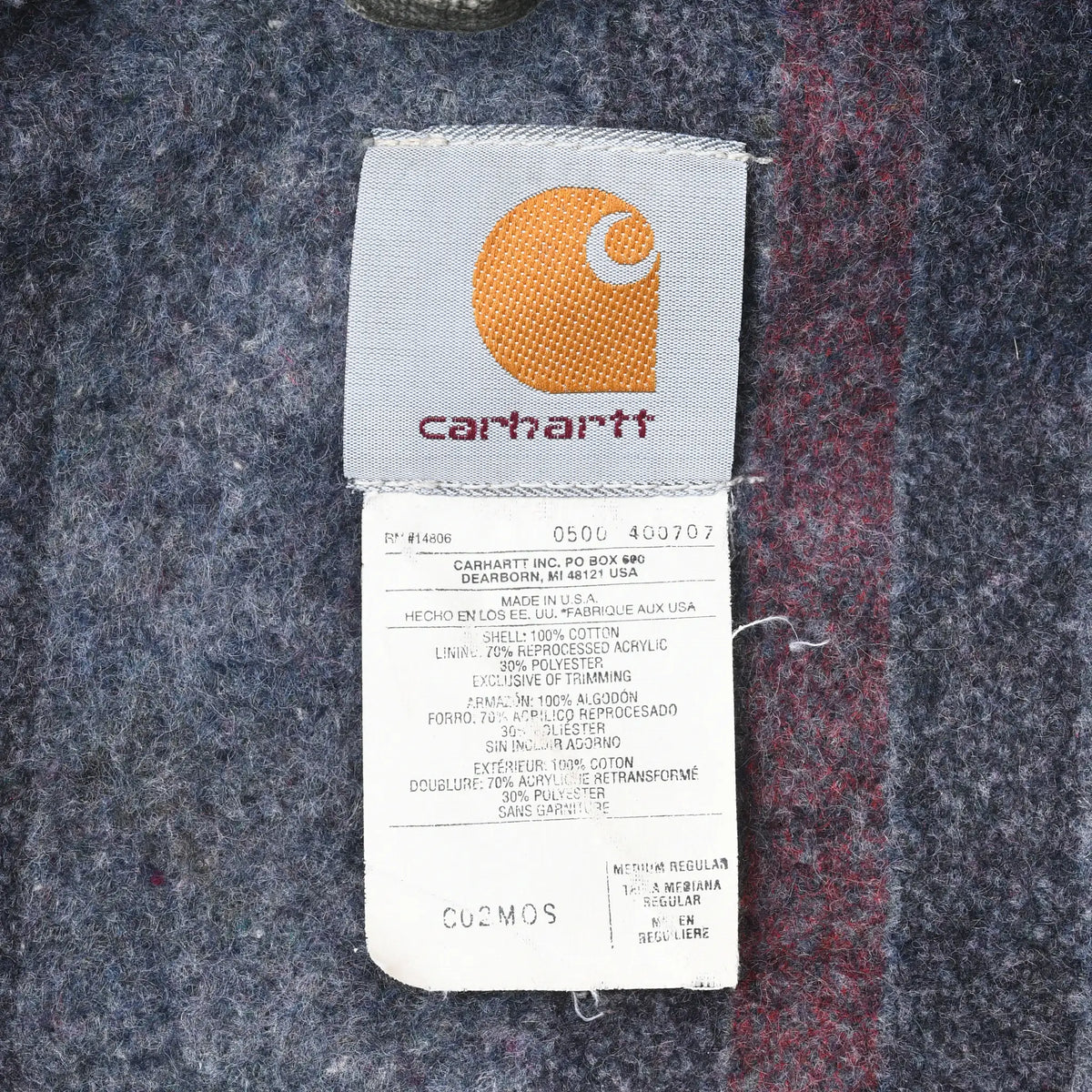 Close-up of Carhartt interior logo and care label showing C02MOS model code