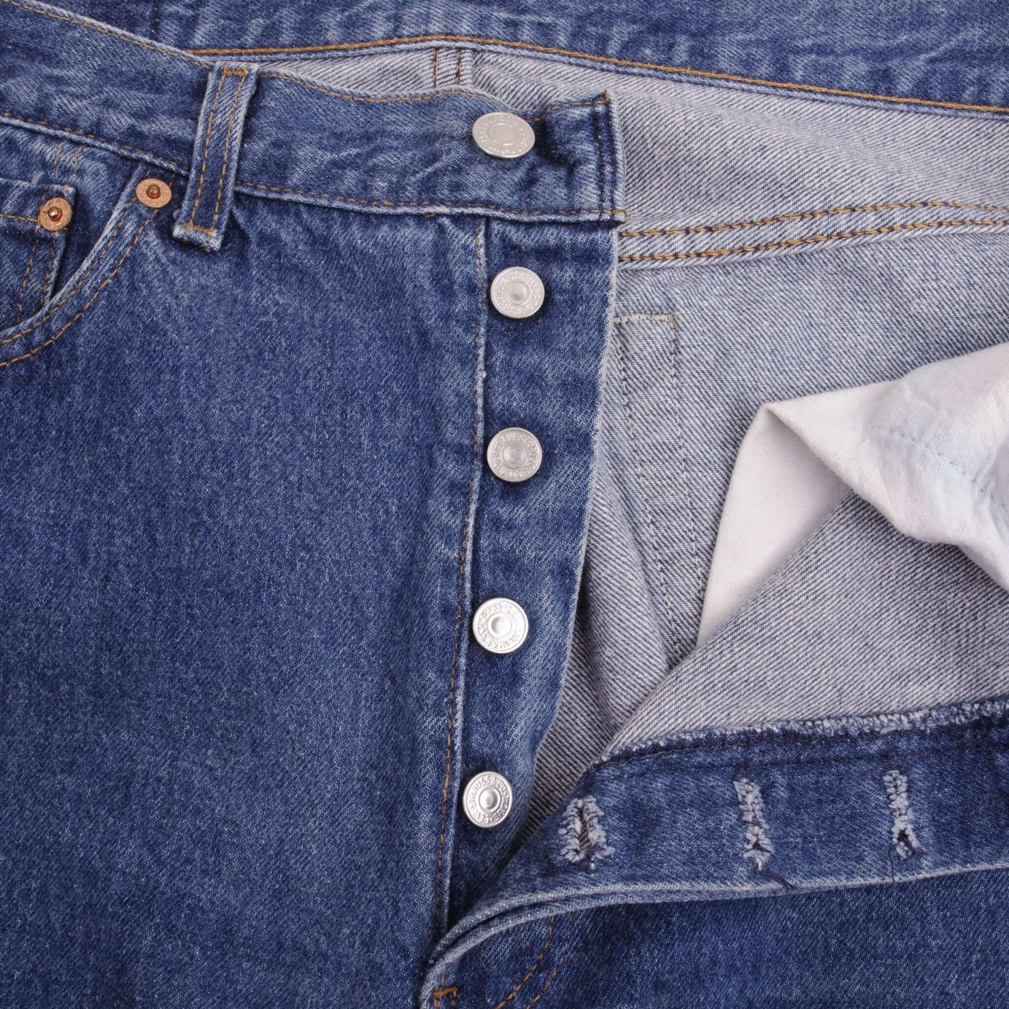 Beautiful Indigo Levis 501 Jeans Made in USA with a medium blue wash Size on Tag 34X32 Actual Size 33X32 Back Button #544