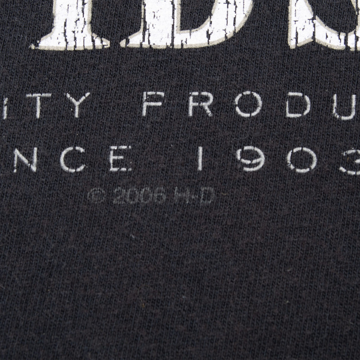 Close-up of front print showing distressed lettering and faint 2006 copyright mark