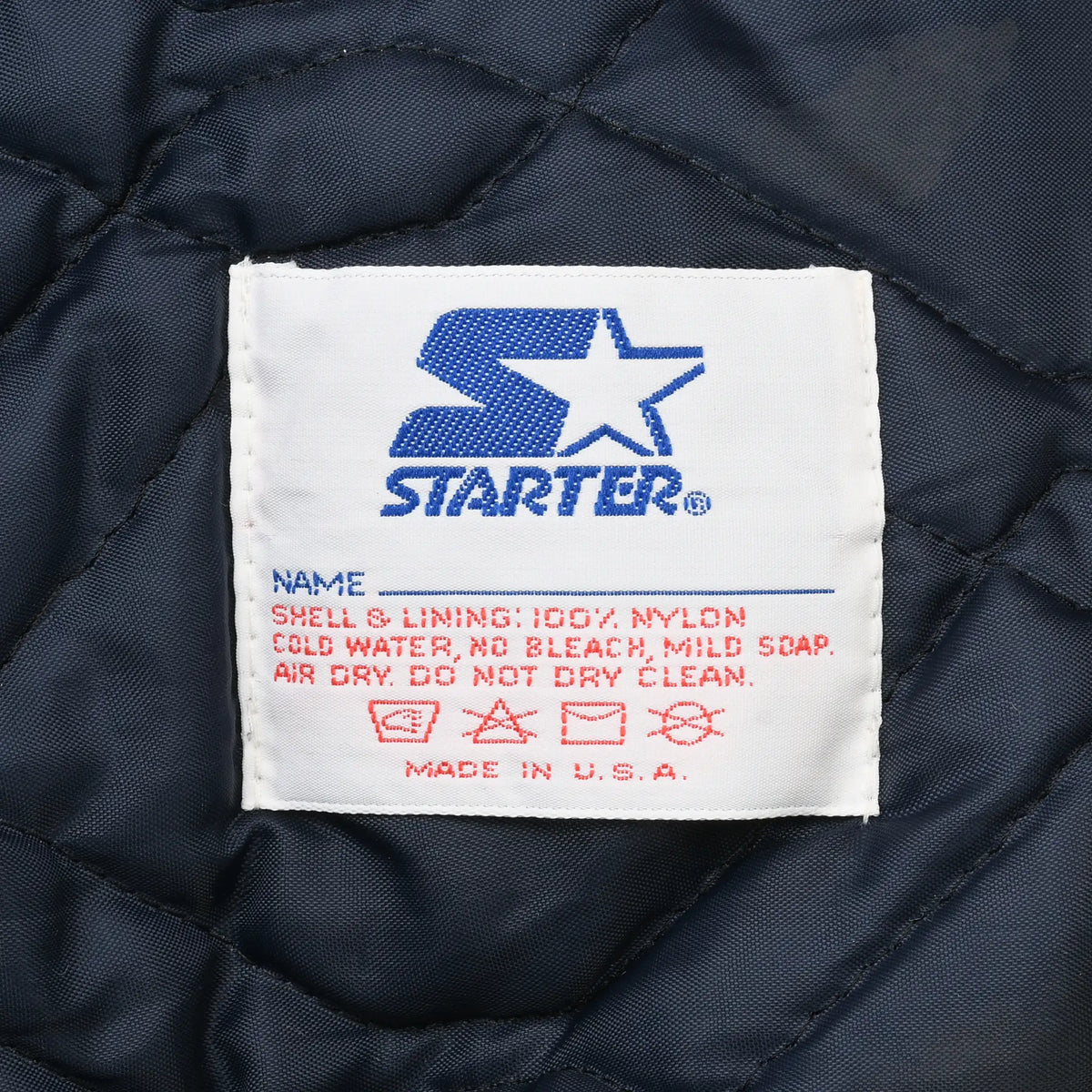 Starter care label with washing instructions and Made in U.S.A. text