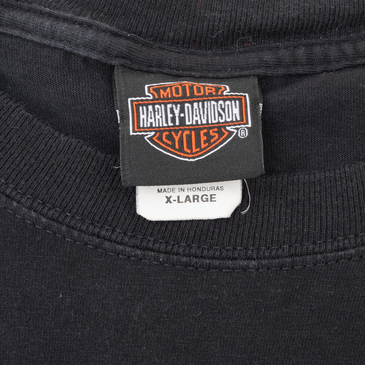 Harley-Davidson neck tag and X-Large size label inside black T-shirt