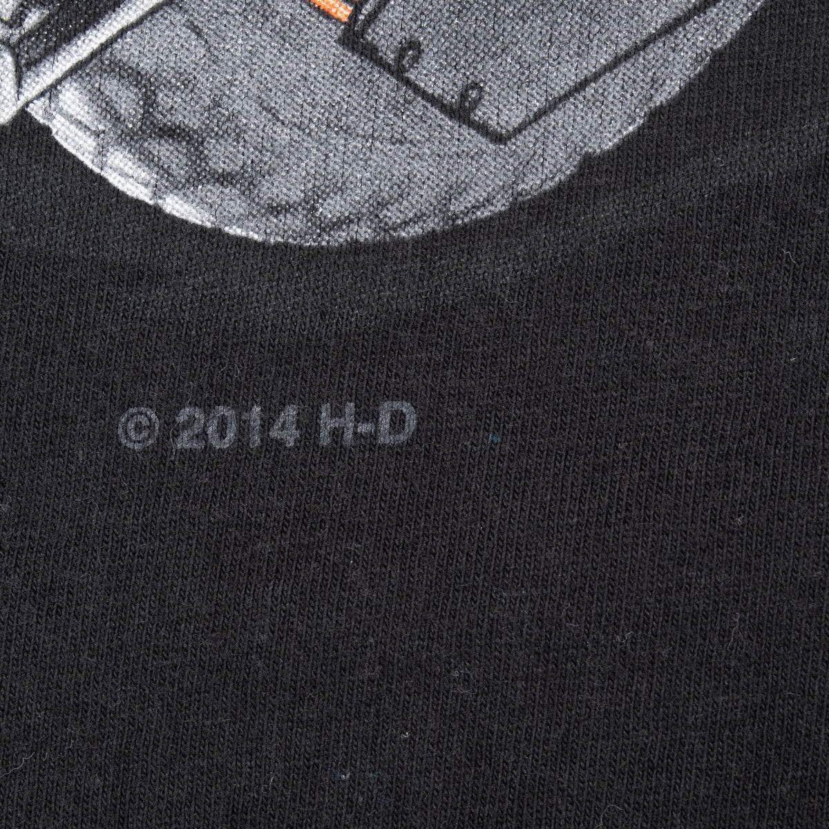 Close-up of © 2014 H-D mark printed below the front graphic