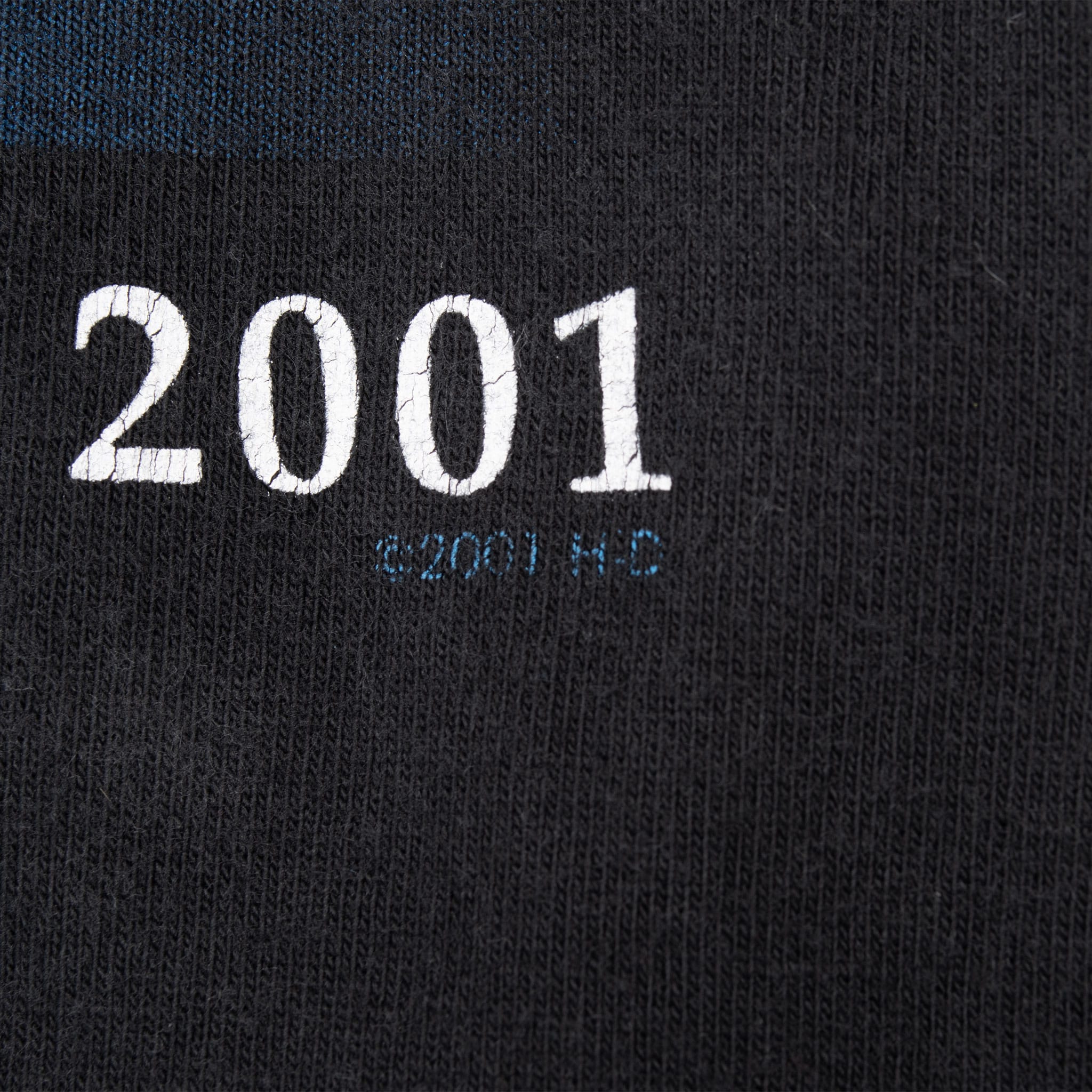 Close-up of 2001 copyright print on black fabric