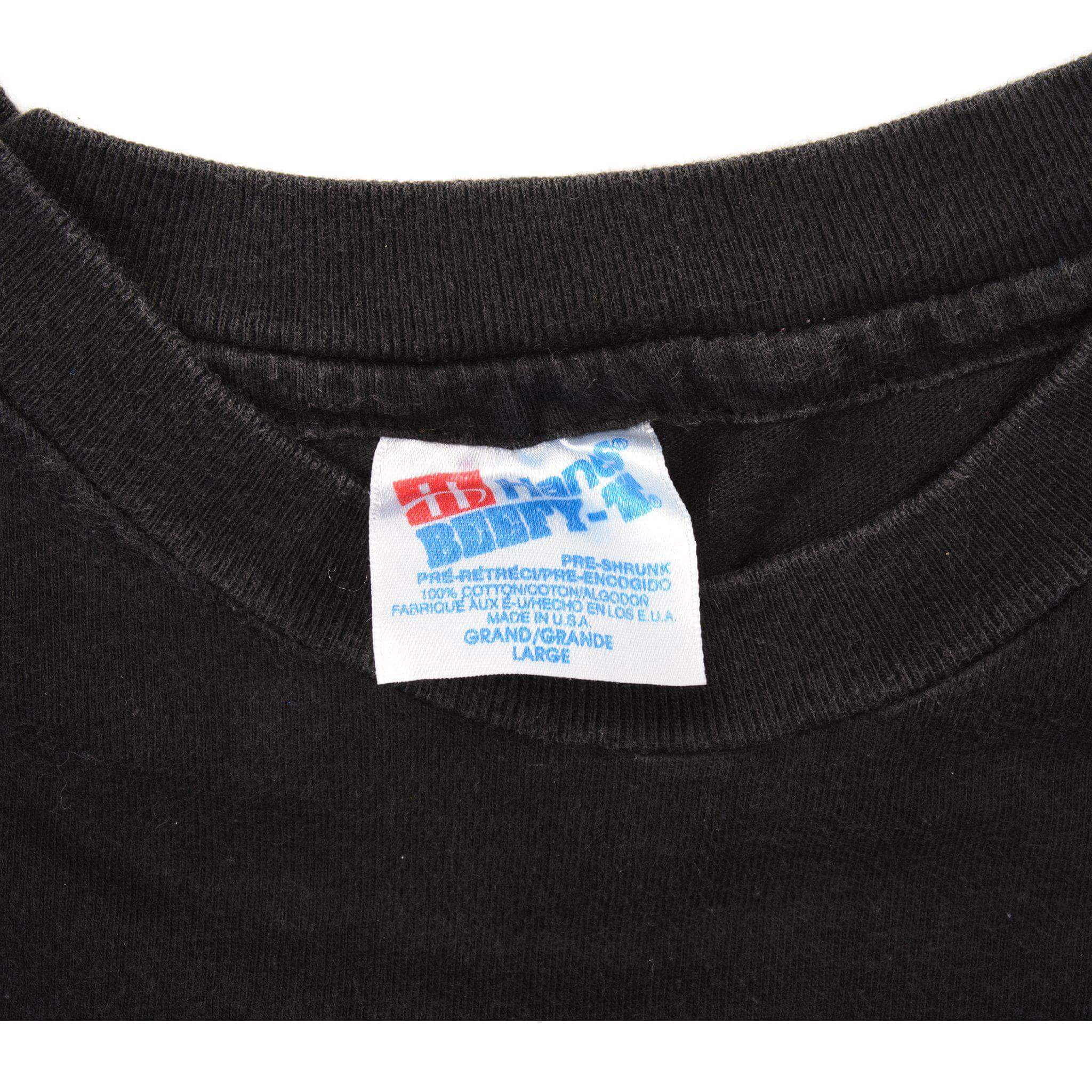 Close-up of Delta Pro Weight large neck tag on black T-shirt