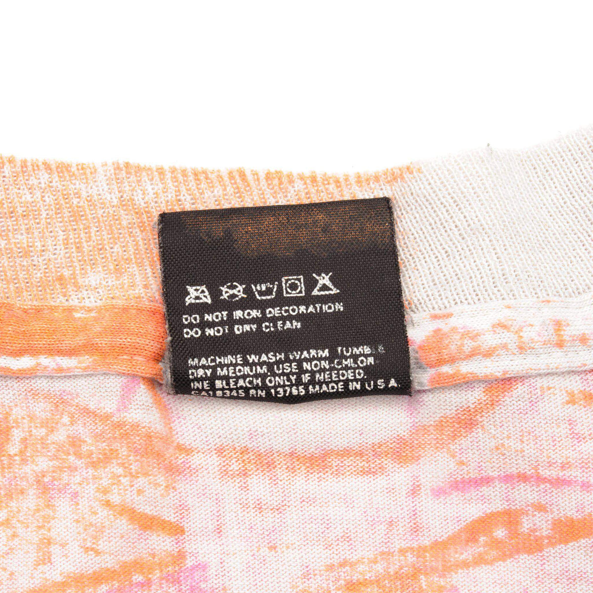 Reverse of neck tag showing care instructions and RN number