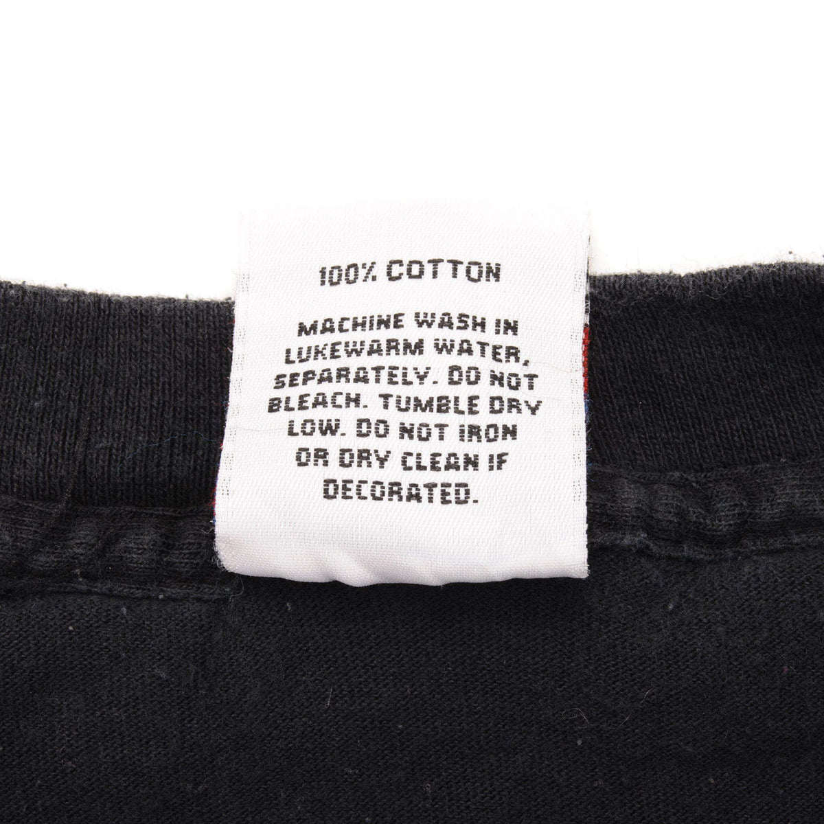 Close-up of 100% cotton care label with washing instructions