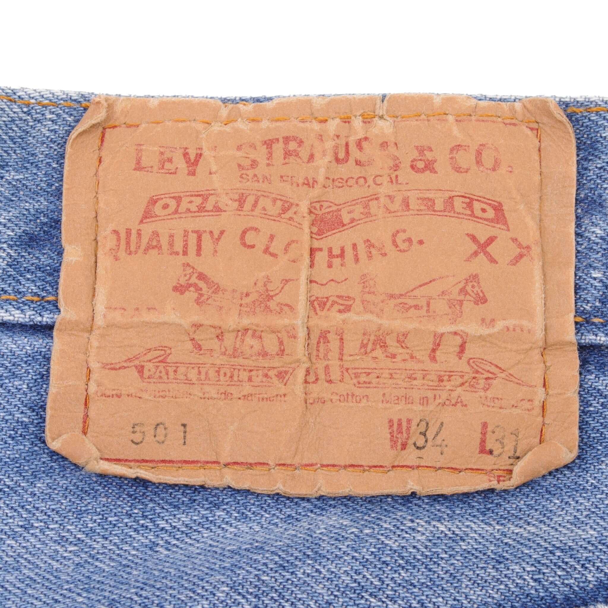 Beautiful Indigo Levis 501 Jeans 1980s Made in USA with Medium Light Wash With Light Whiskers Size on tag 34X31 Actual Size 32X29 Back Button #524