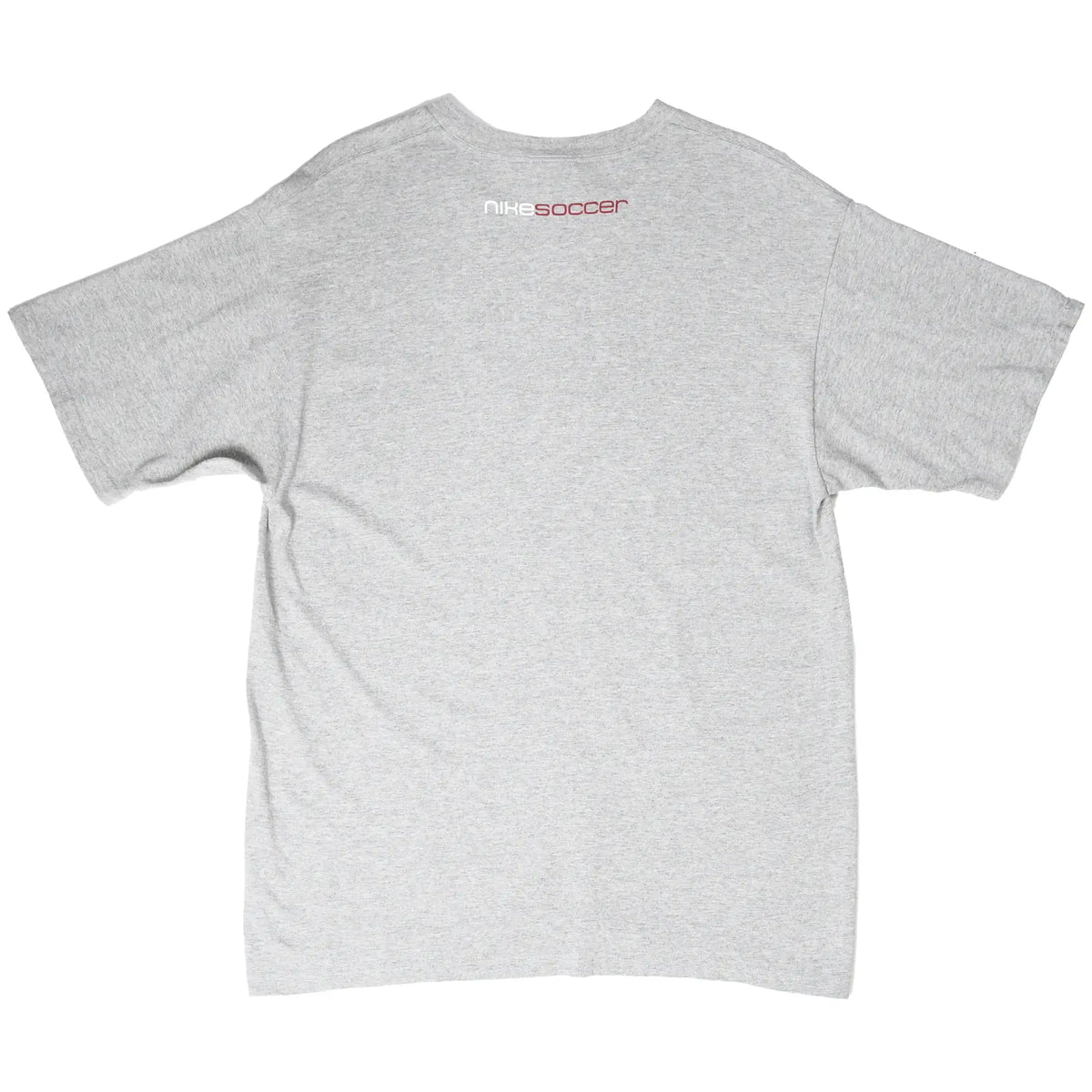 Back of grey Nike T-shirt with small white and red Nike Soccer print below collar