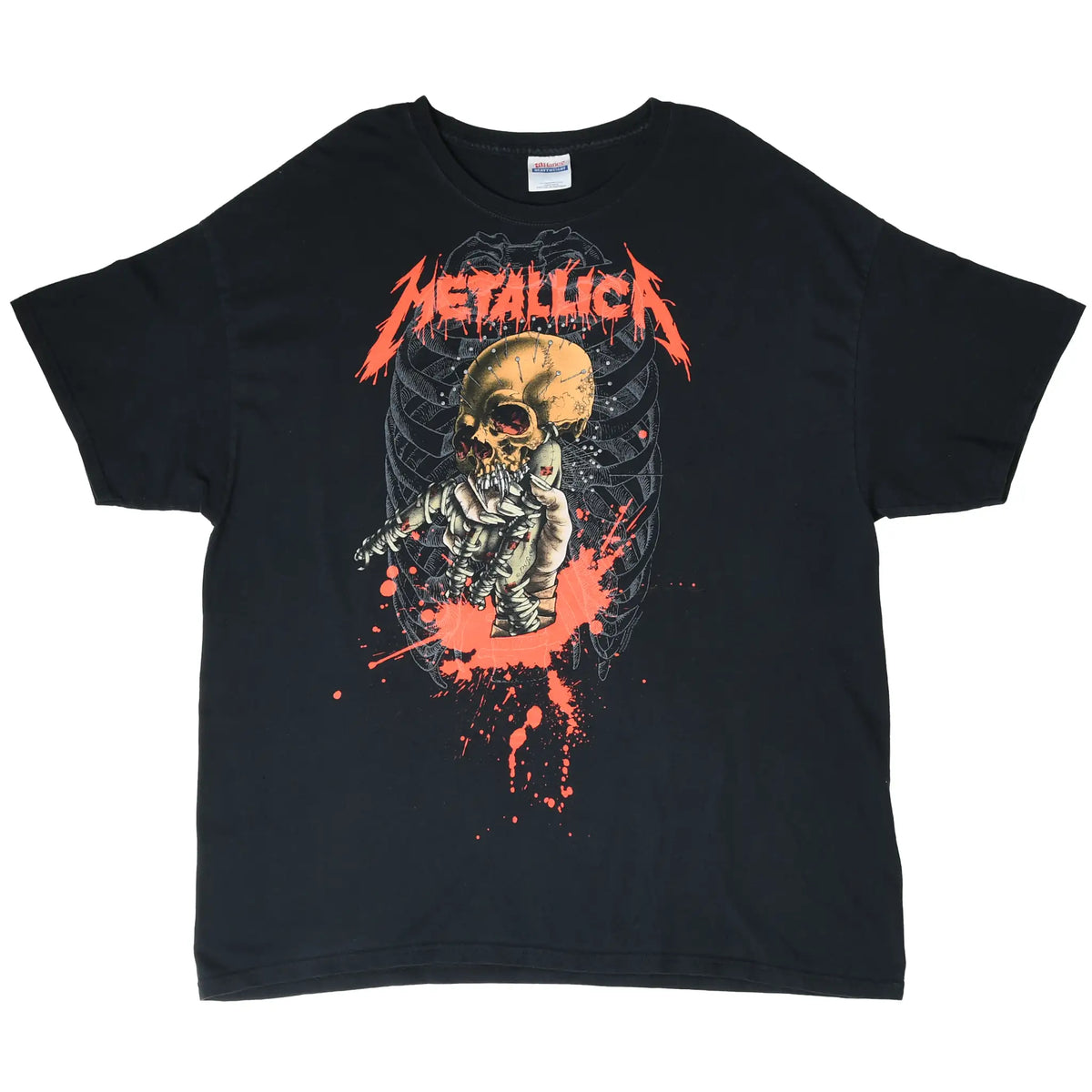 Full front view of black Metallica T-shirt with skull, skeleton, rib cage, and red splatter print