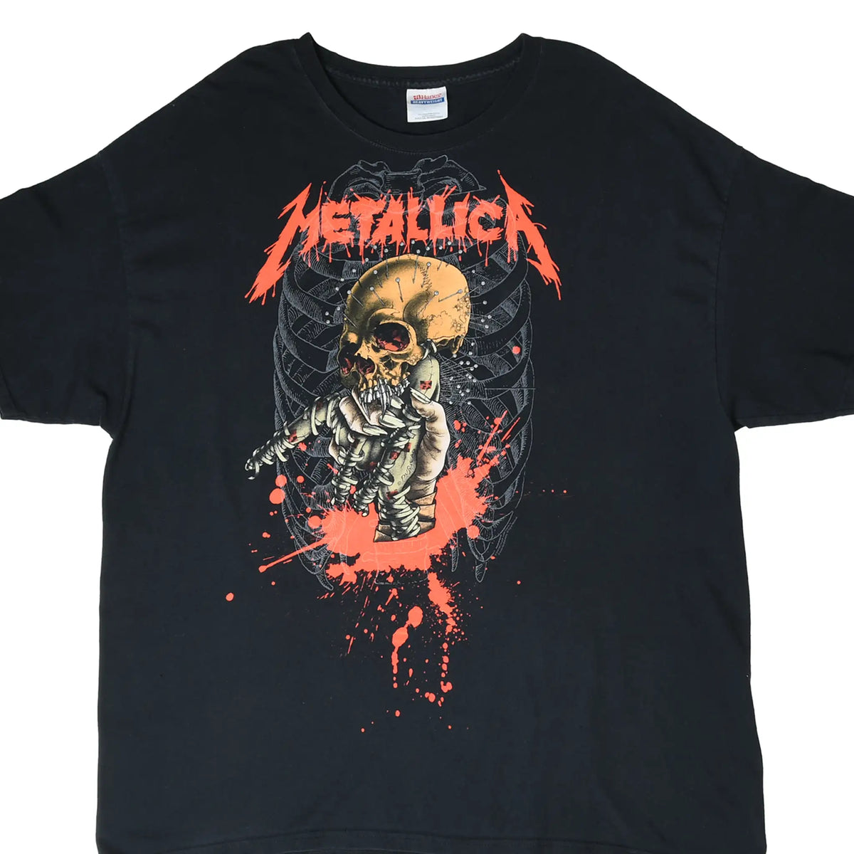 Front of black Metallica T-shirt with red logo and skull emerging from a wrapped skeleton graphic
