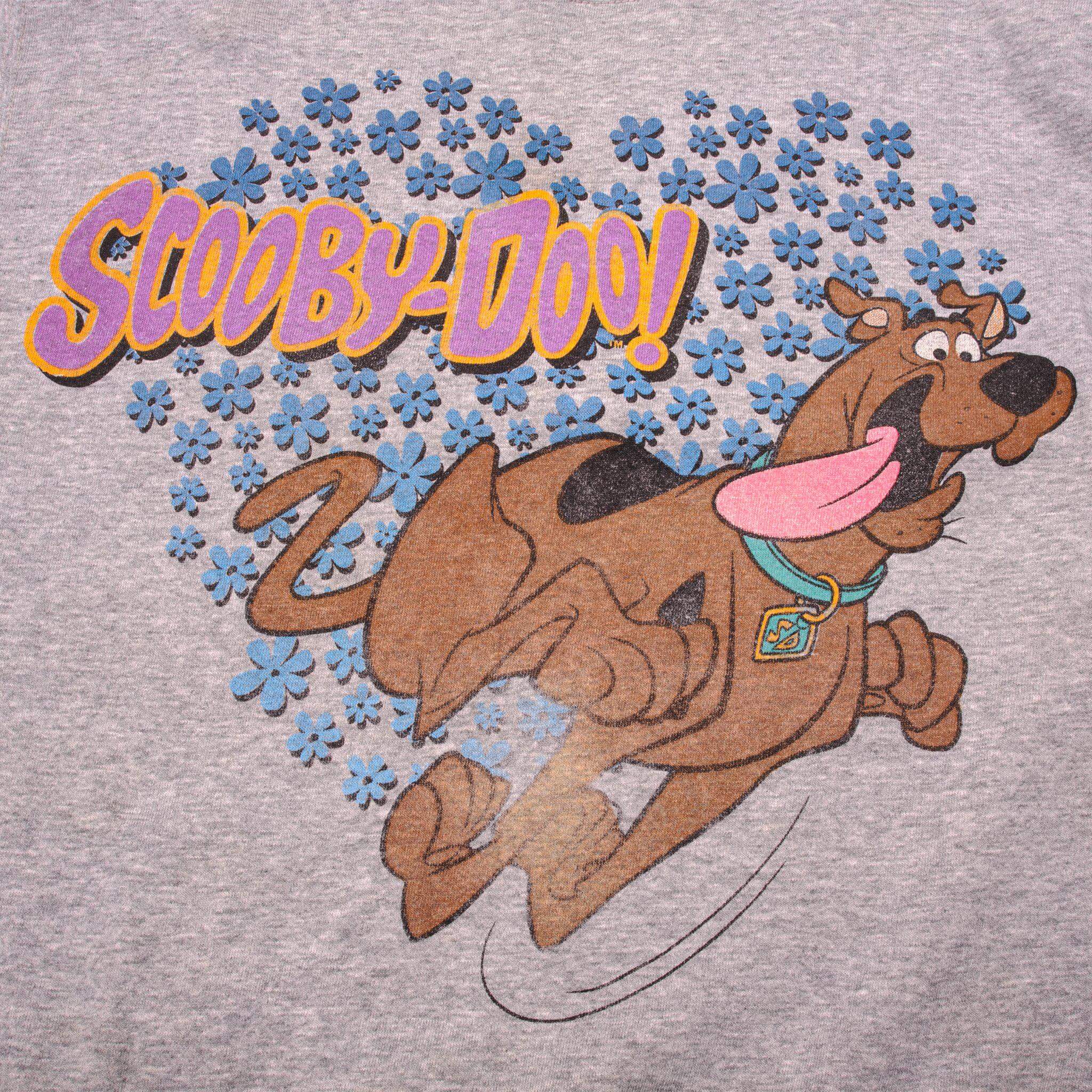 Close-up of running Scooby-Doo graphic surrounded by blue flowers