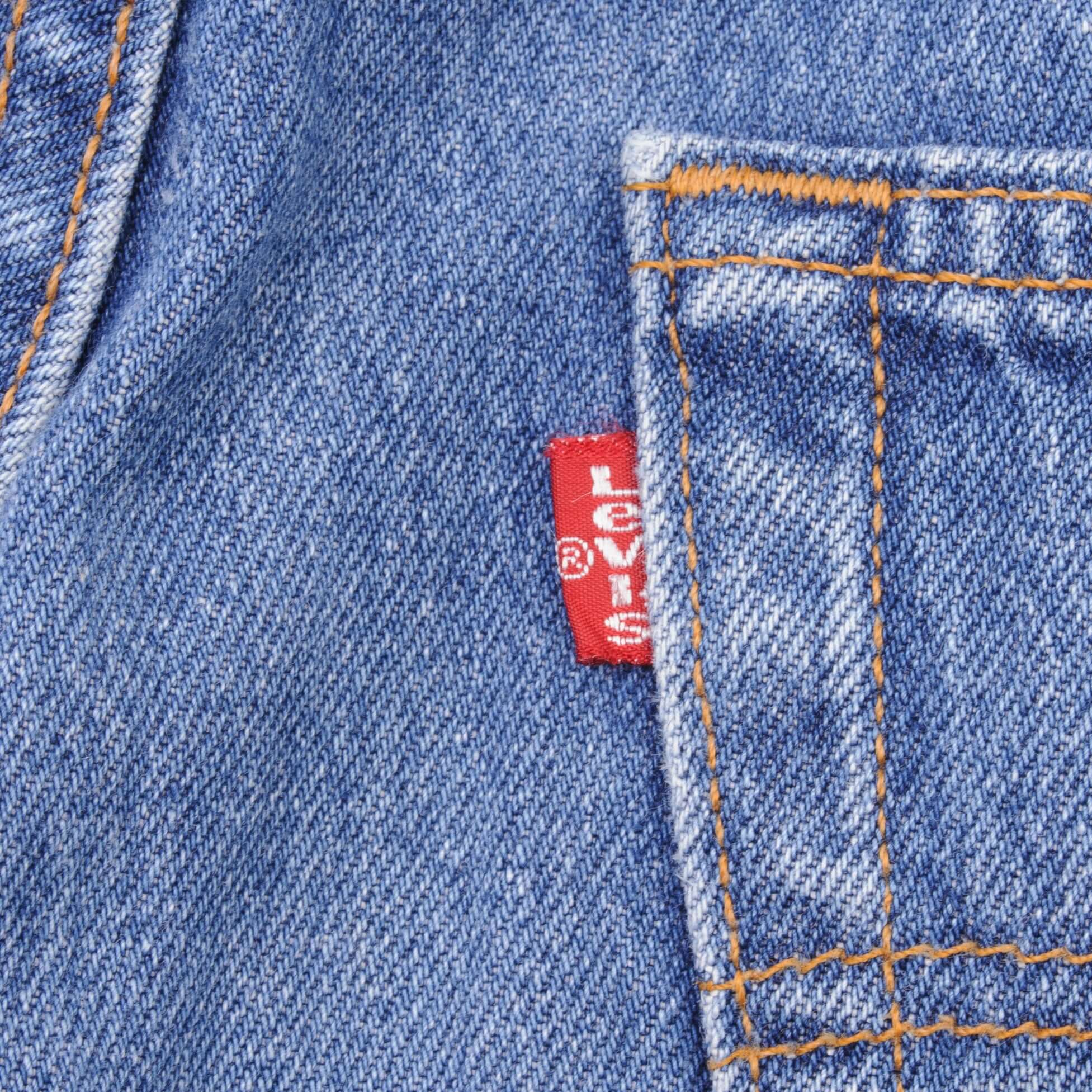 Beautiful Indigo Levis 501 Jeans 1990s Made in USA with Medium Light Wash With Light Whiskers Size on tag 34X30 Back Button #511