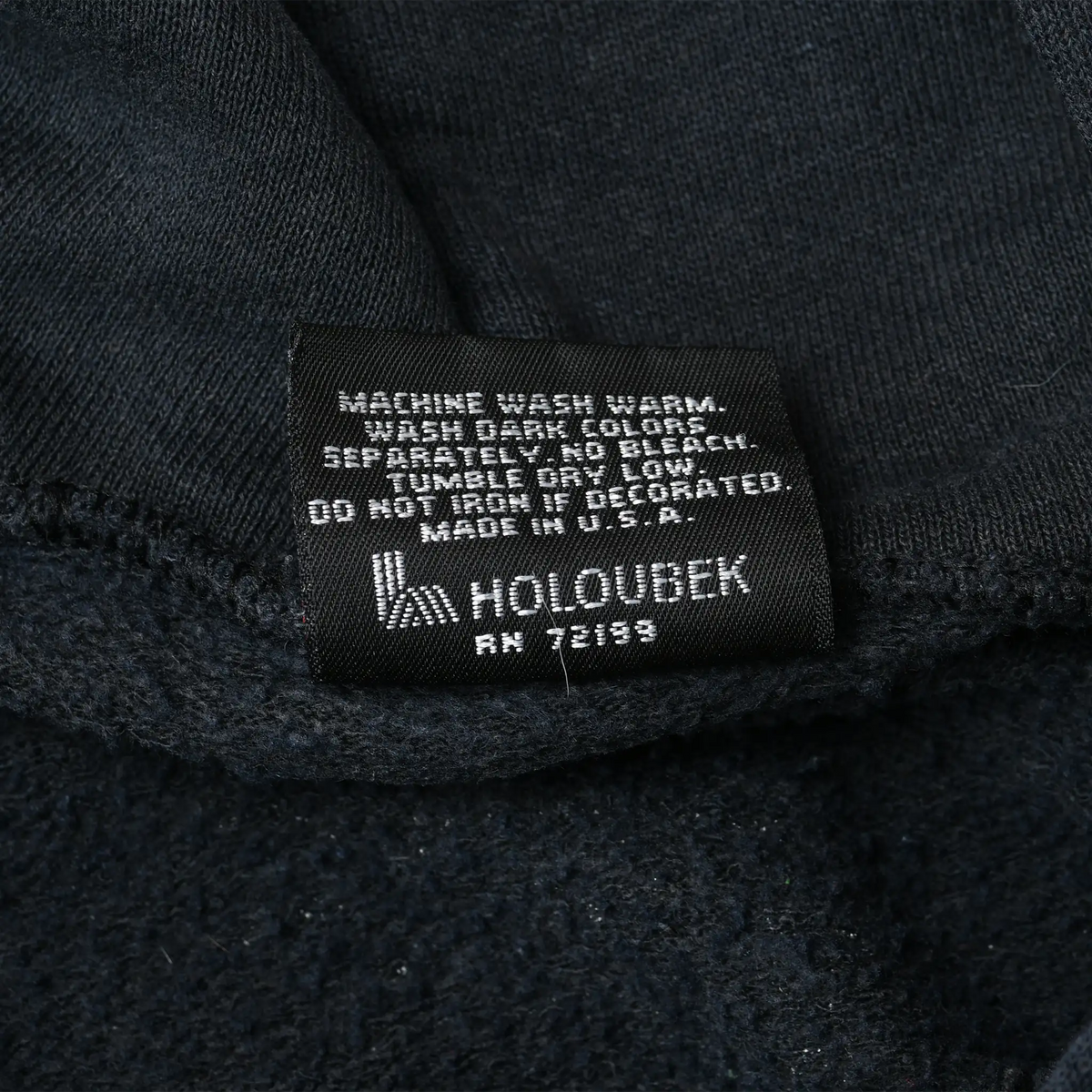 Black Holoubek care label with washing instructions inside Harley-Davidson hoodie