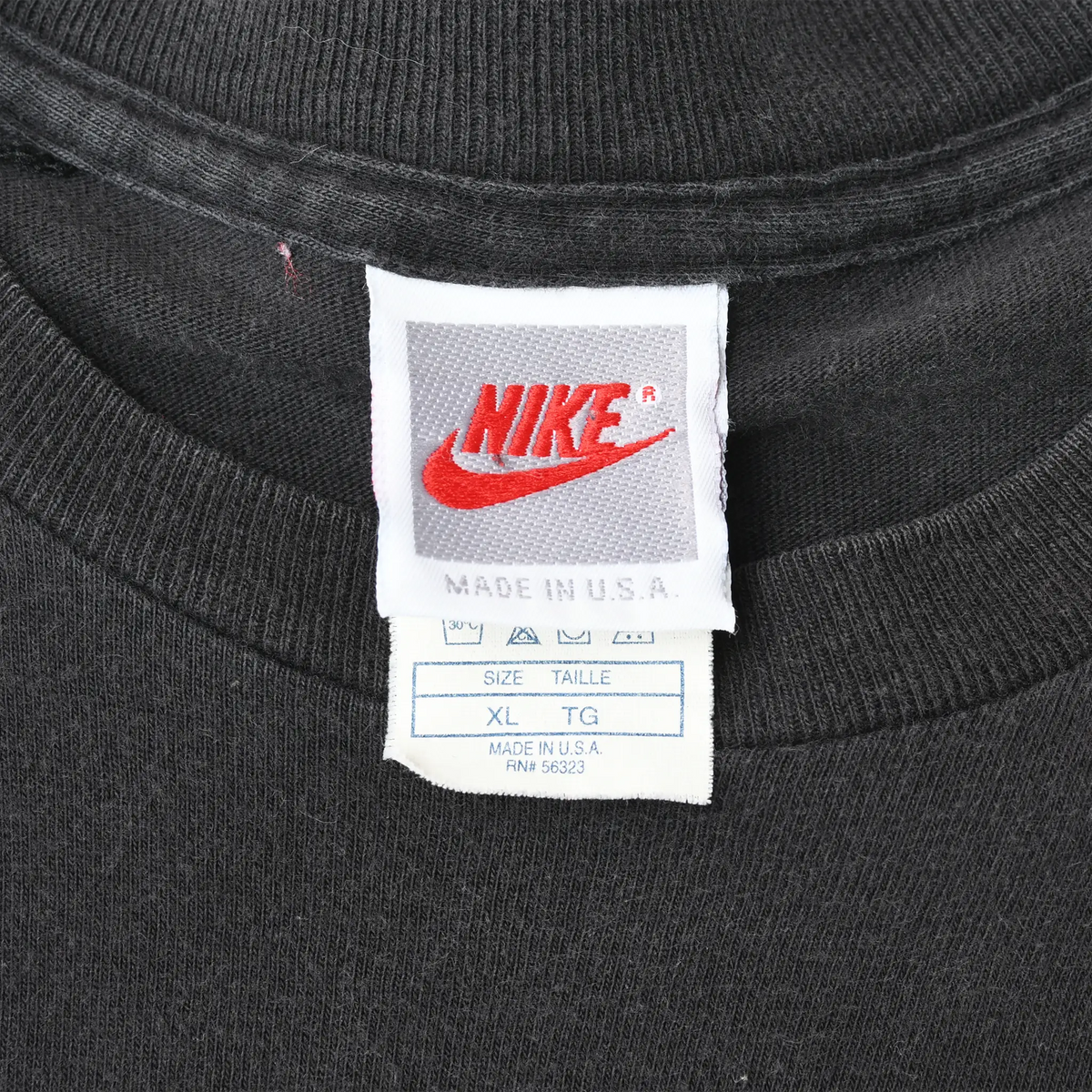 Close-up of Nike neck labels showing Made in USA and size XL