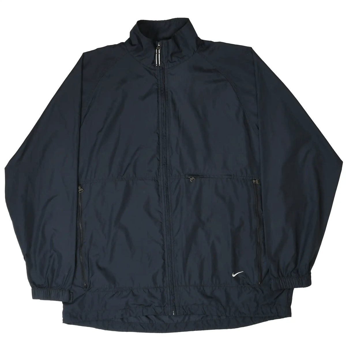 Front of black Nike windbreaker jacket laid flat, showing full zip and white Swoosh