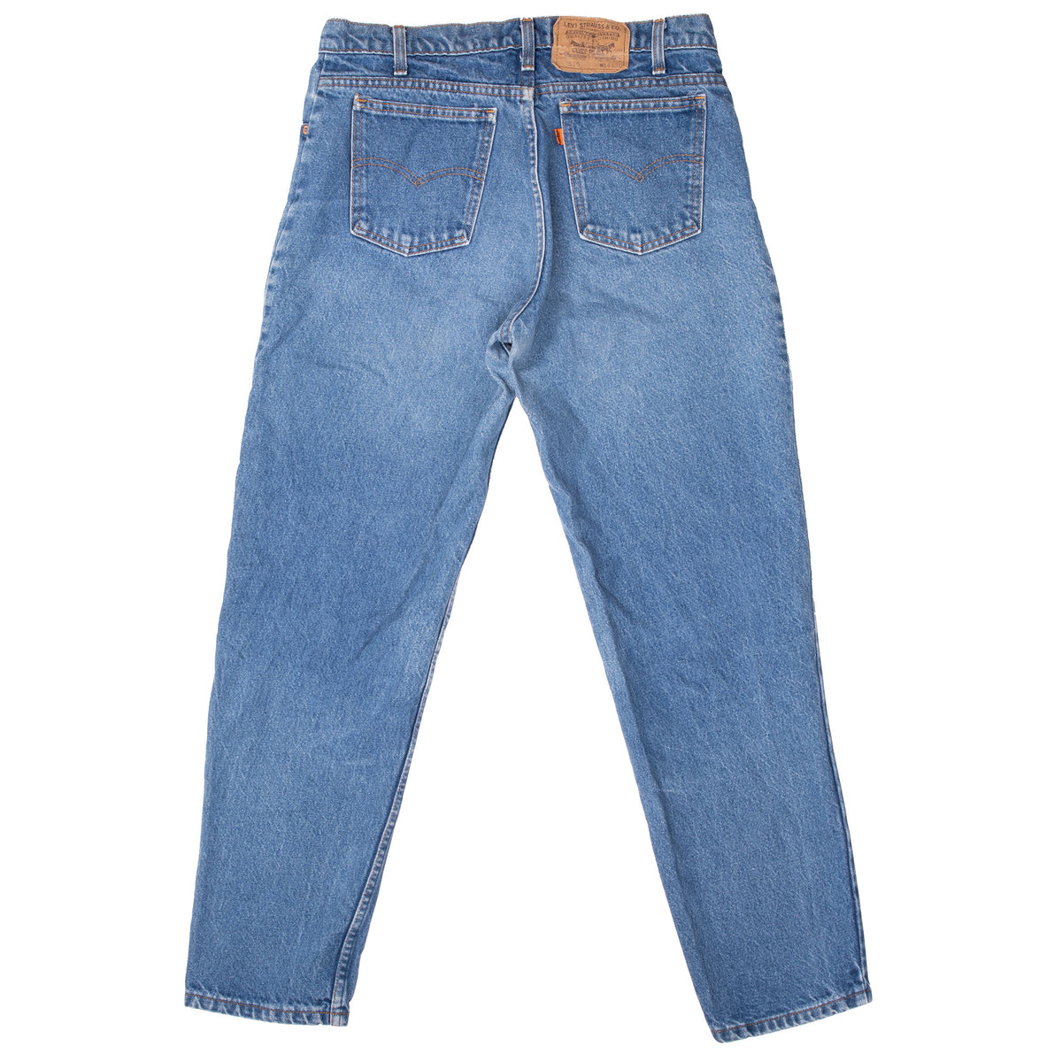 Back view of Levi's 550 medium-wash blue jeans with orange tab and patch