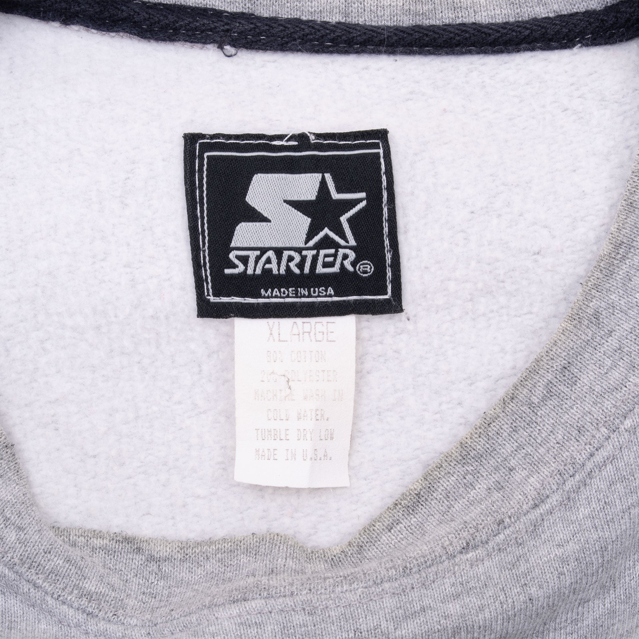 Starter neck label and X-Large care tag inside gray sweatshirt