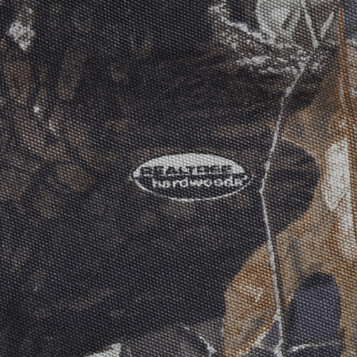Close-up of Realtree Hardwoods logo printed on the camouflage fabric