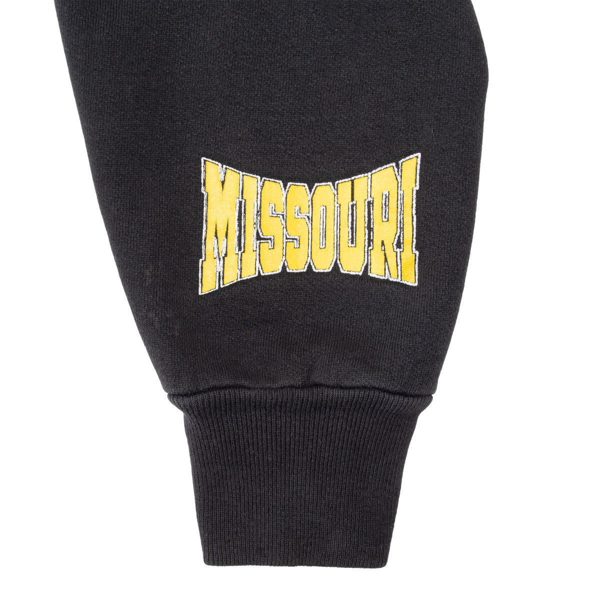 Close-up of yellow Missouri print above the ribbed sleeve cuff