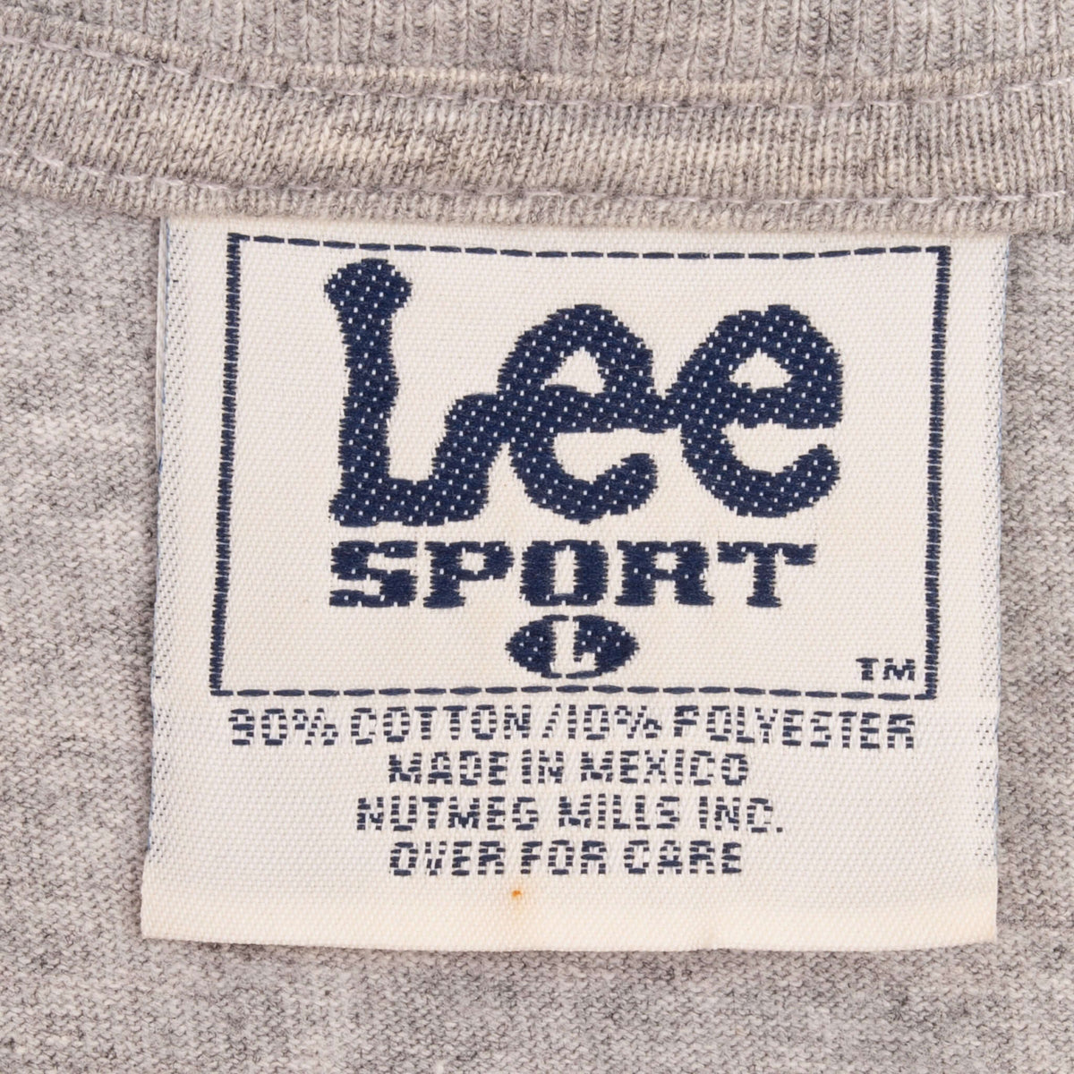 Close-up of Lee Sport size large neck tag on gray T-shirt