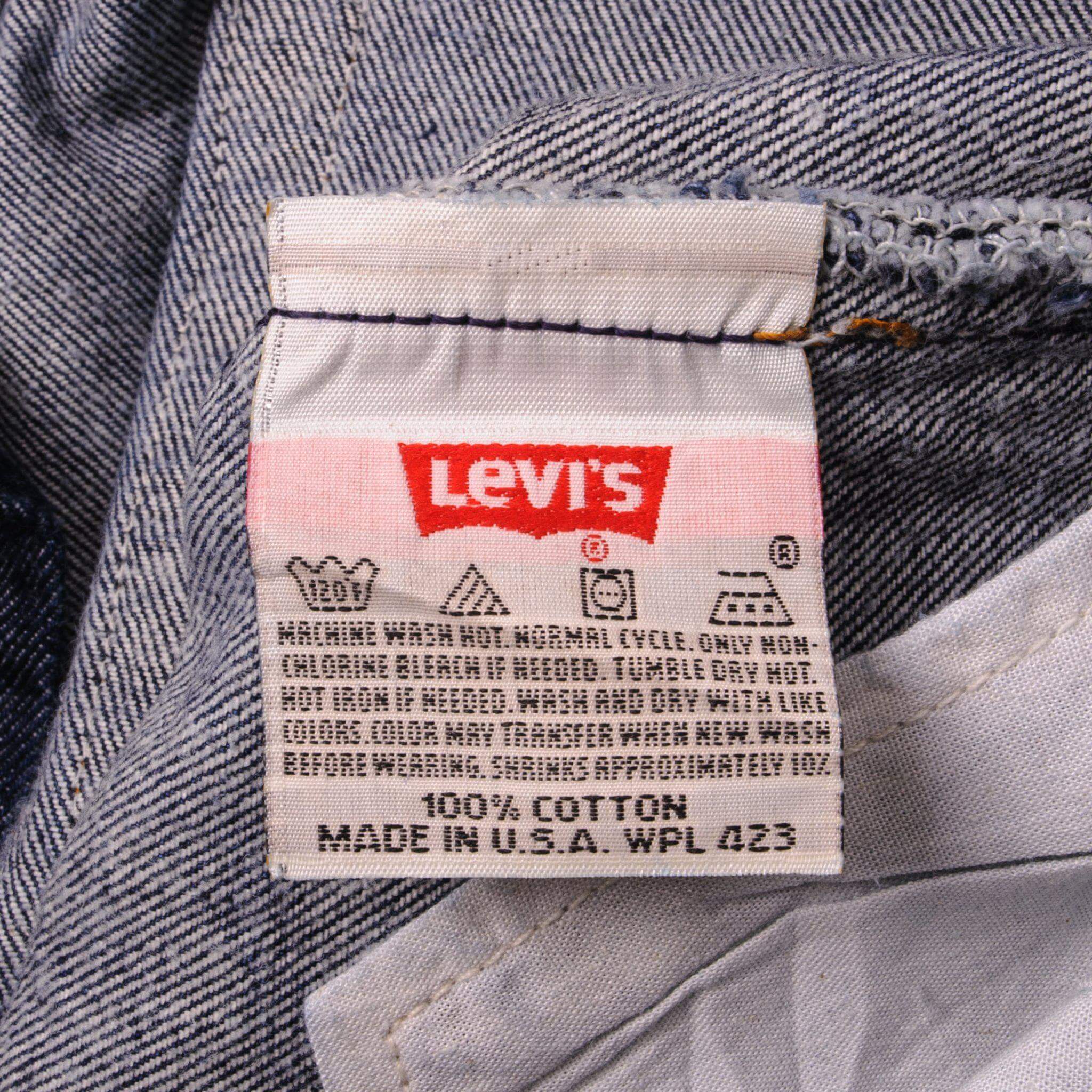 Beautiful Indigo Levis 501 Jeans 1990s Made in USA with a very dark wash. Size on Tag 40X34 ACTUAL SIZE 38X31 Back Button #u53