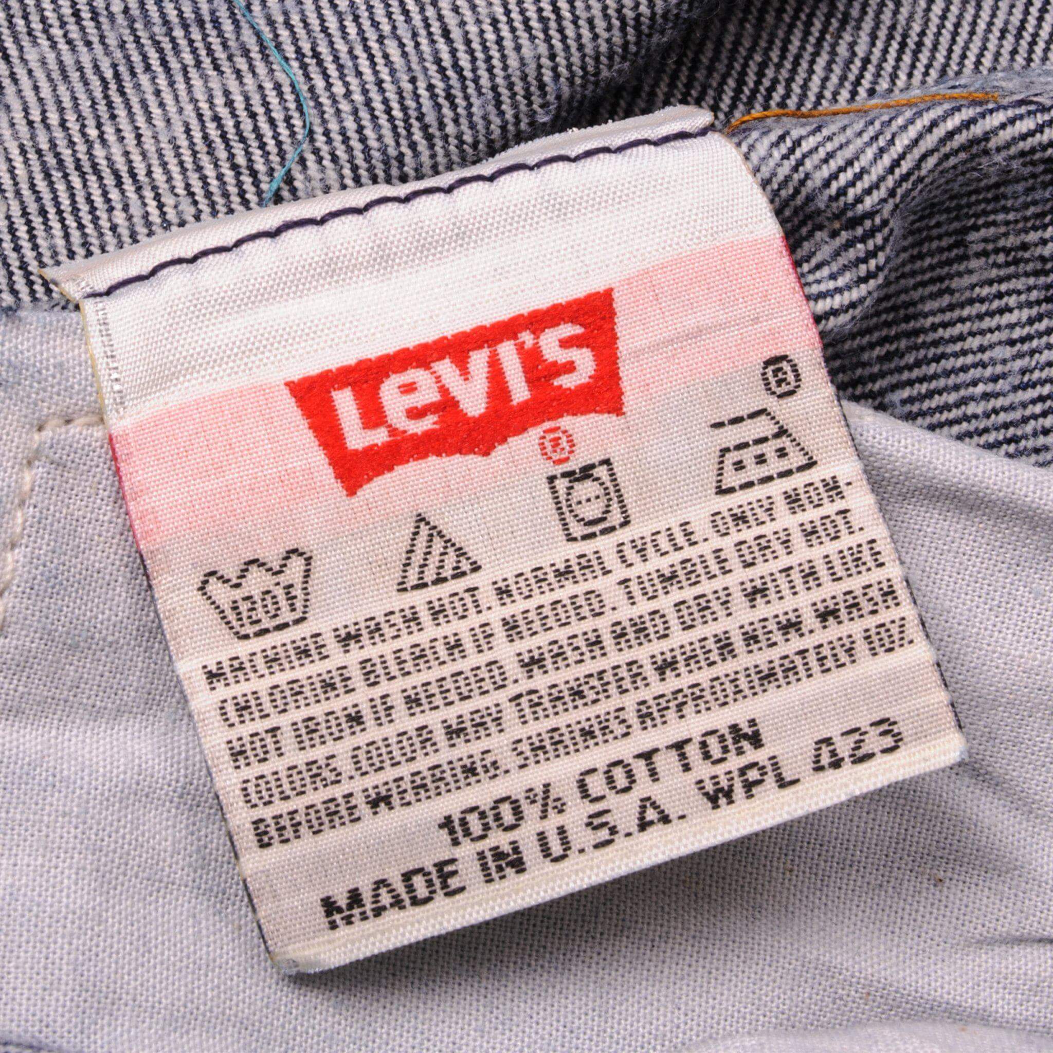 Beautiful Indigo Levis 501 Jeans 1990s Made in USA with a very dark wash. Size on Tag 40X34 ACTUAL SIZE 38X31 Back Button #u53