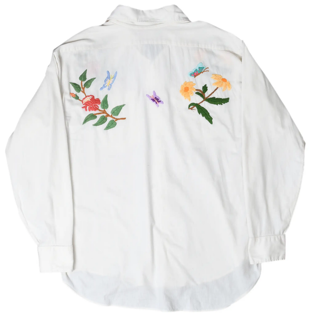 Back of white Levi's shirt with embroidered flowers and butterflies across the shoulders
