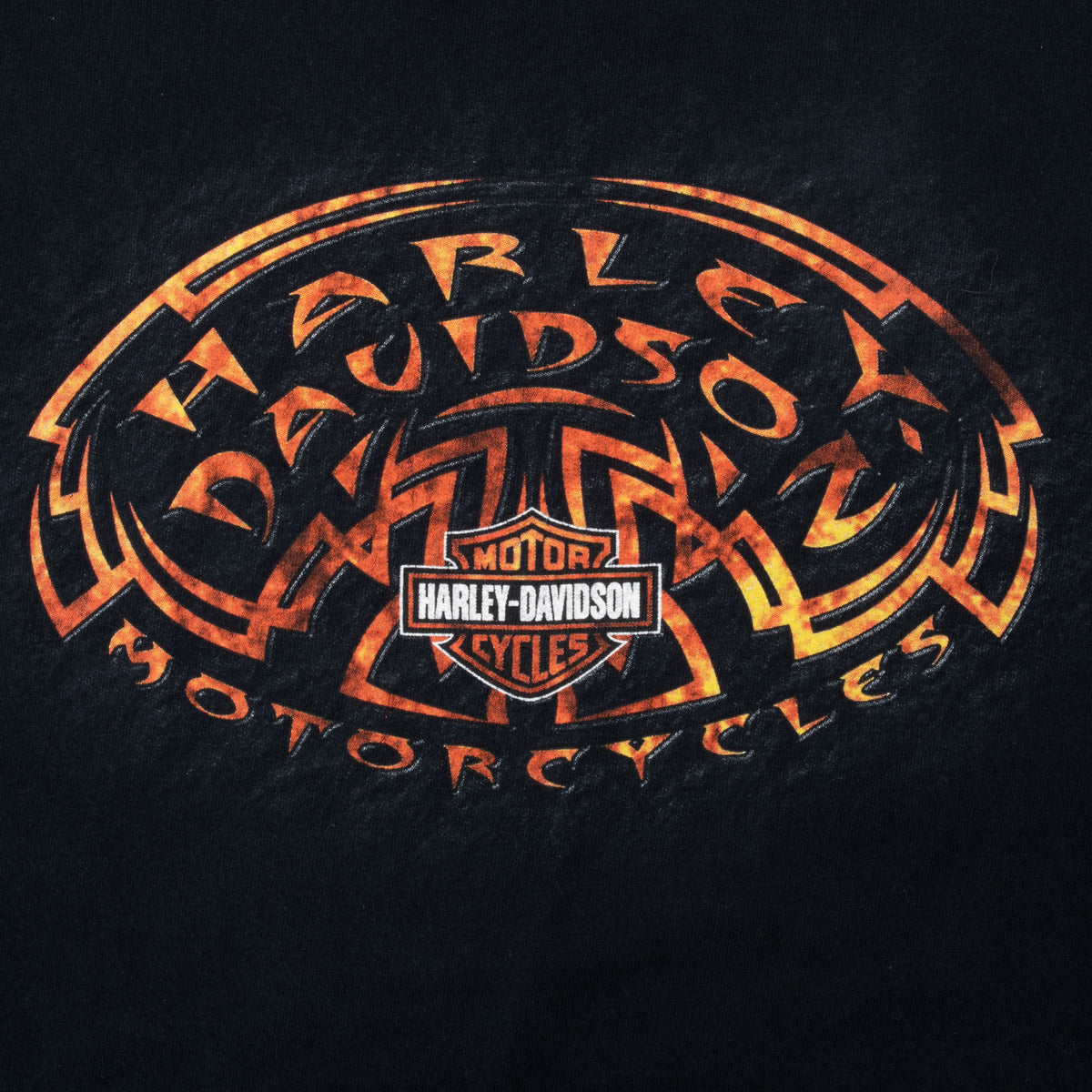 Close-up of orange tribal-style Harley-Davidson Motorcycles front graphic