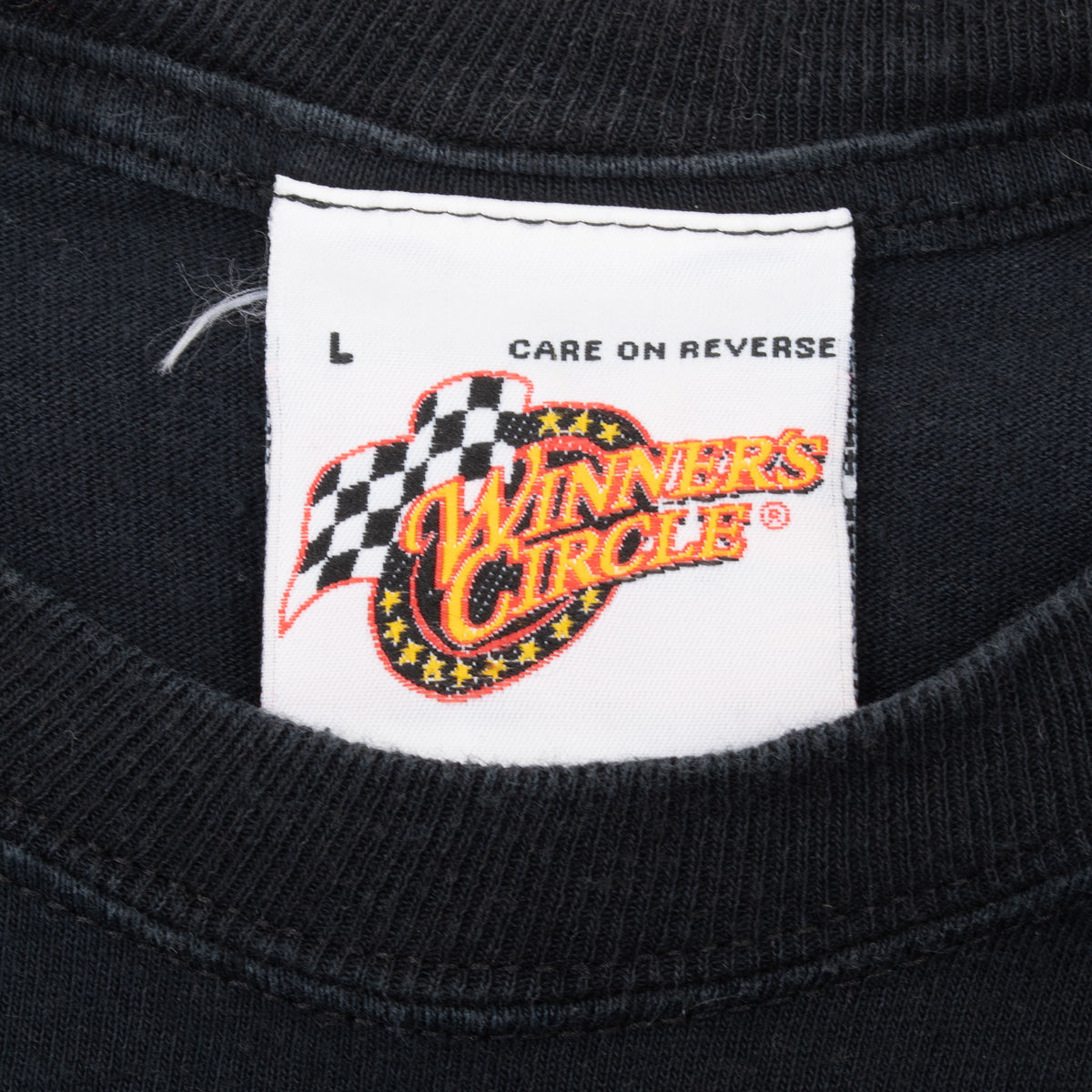 Winners Circle neck label with L marking and care-on-reverse text