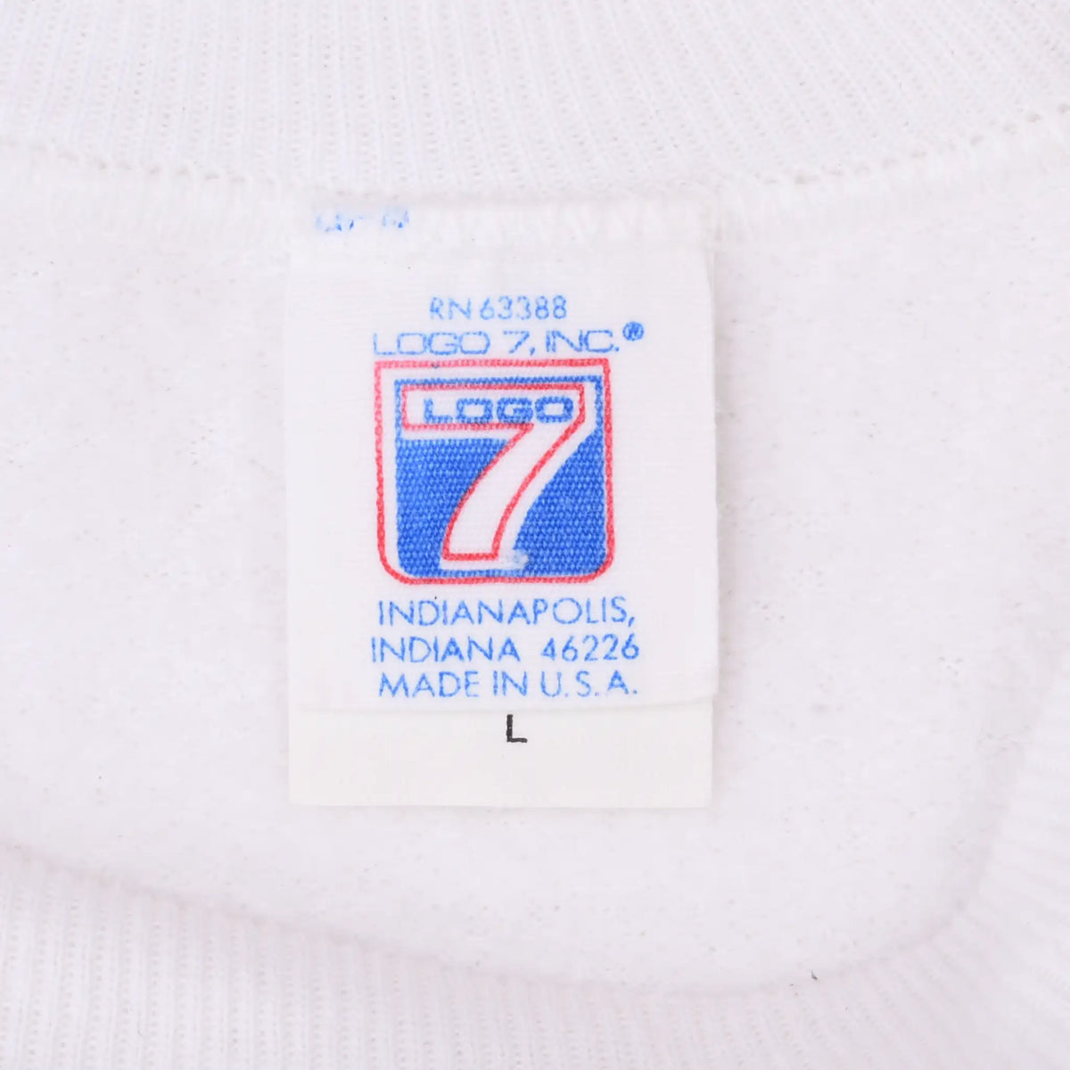 Close-up of Logo 7 neck label with Indianapolis address and Made in U.S.A. text