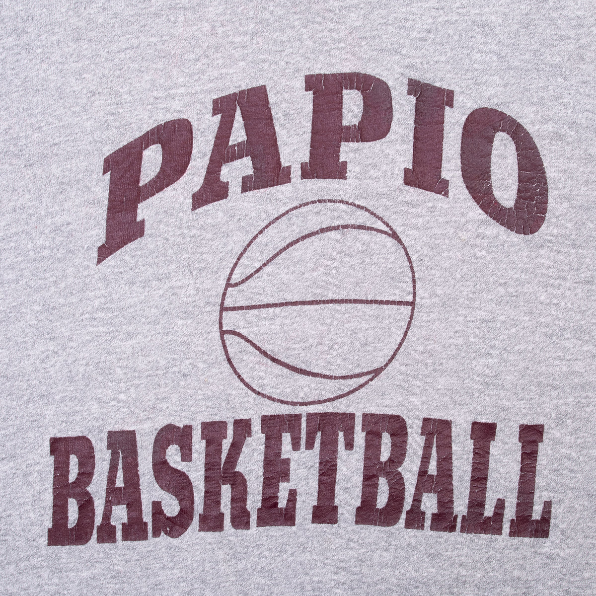 Close-up of maroon Papio Basketball print with basketball graphic