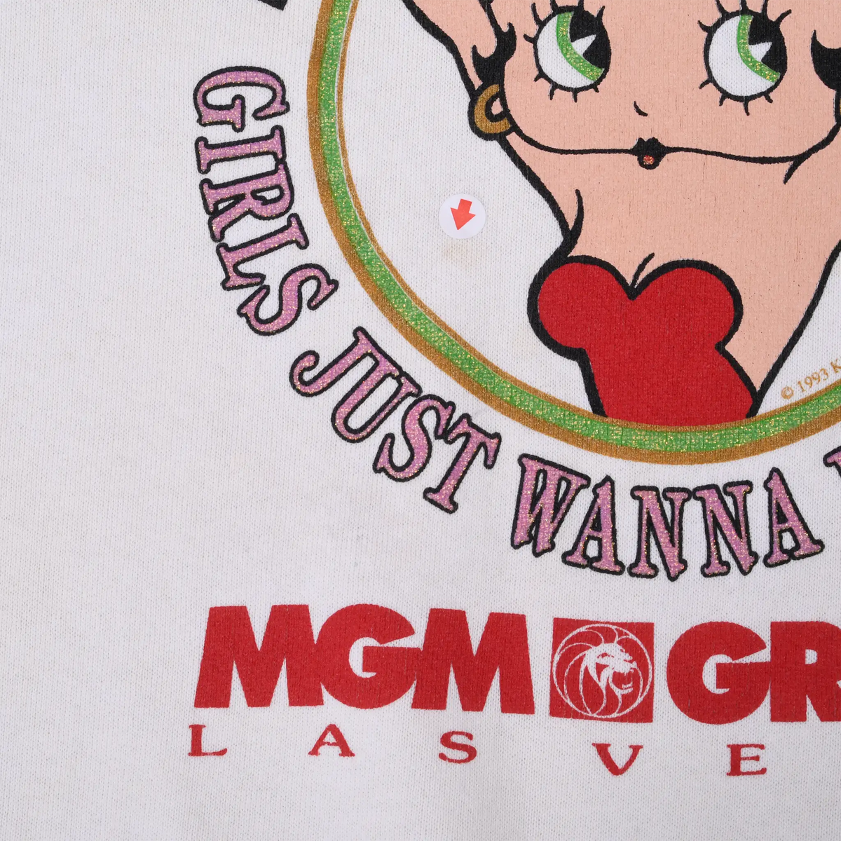 Close-up of Betty Boop graphic, Girls Just Wanna text, and red MGM Grand Las Vegas logo