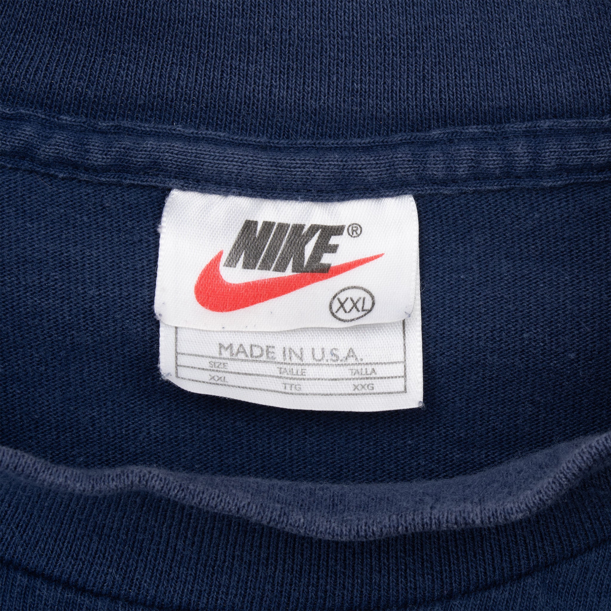 Nike neck tag showing size 2XL and Made in USA text