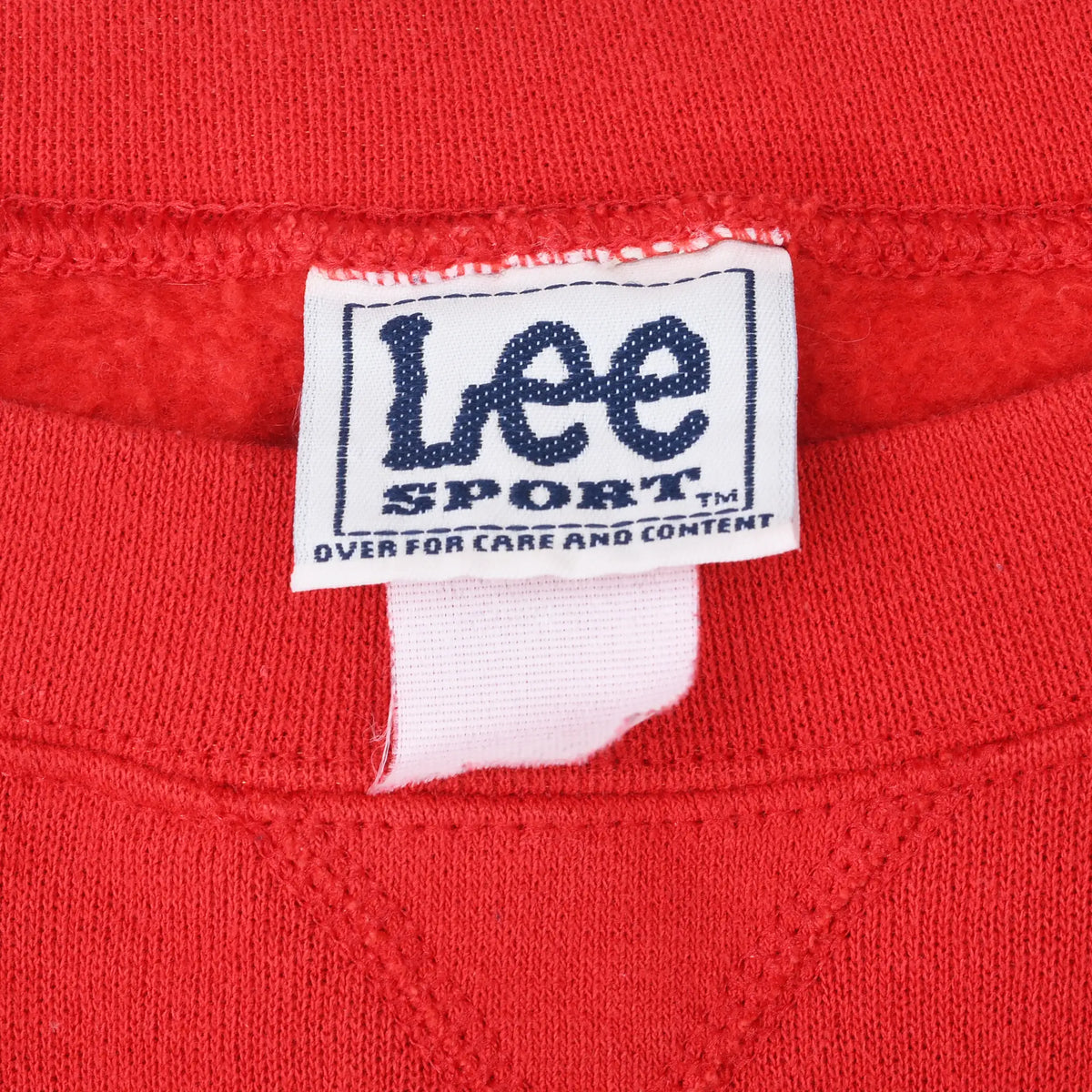 Close-up of Lee Sport neck label inside red sweatshirt
