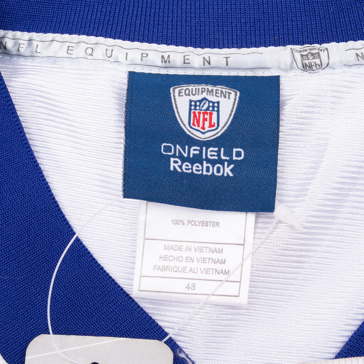 Close-up of NFL Equipment Onfield Reebok neck label and size 48 tag