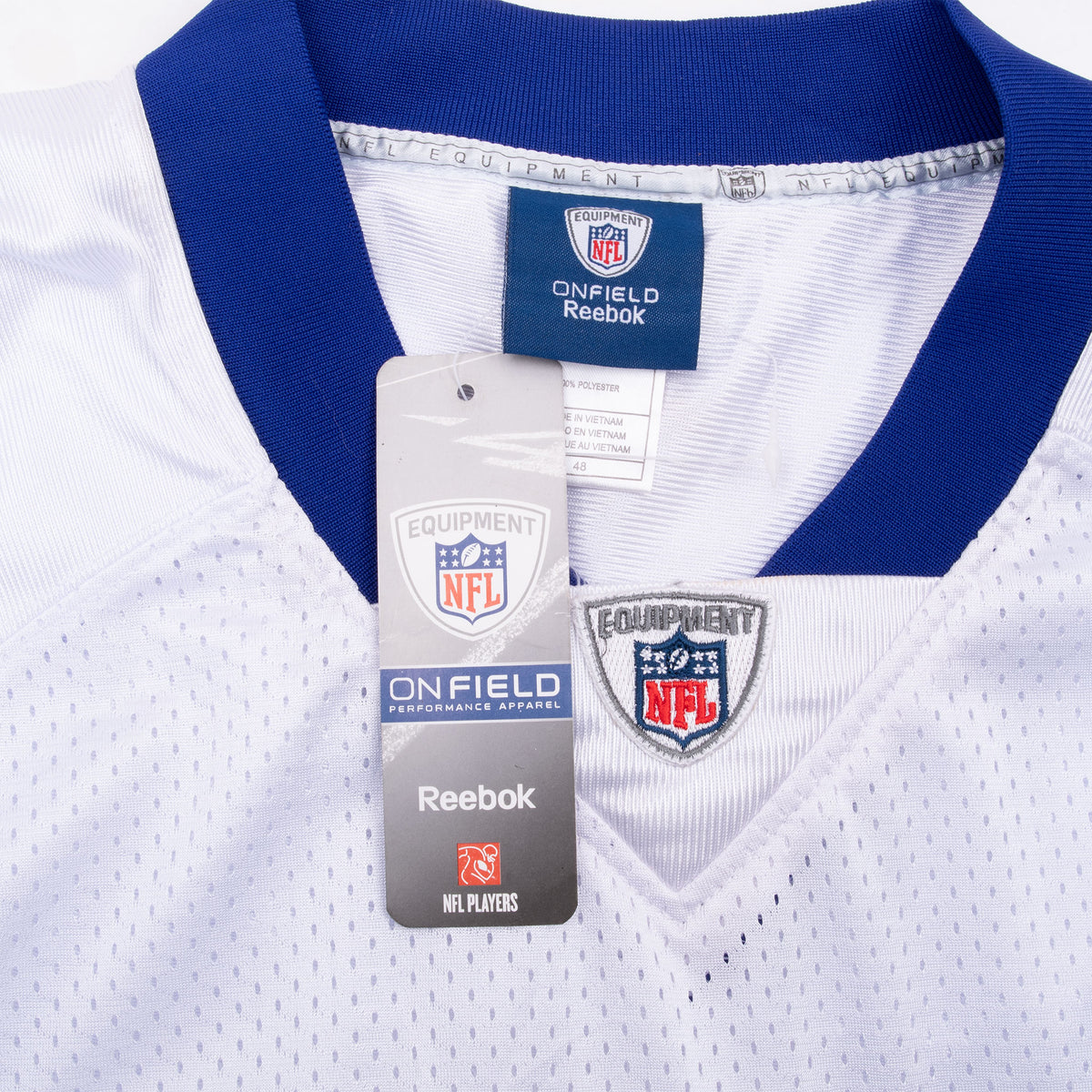 Reebok and NFL hangtag at the blue collar and embroidered NFL shield