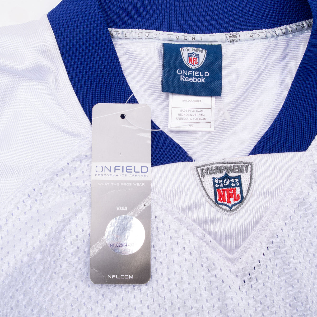 Reverse of Onfield hangtag beside Reebok neck label and embroidered NFL shield