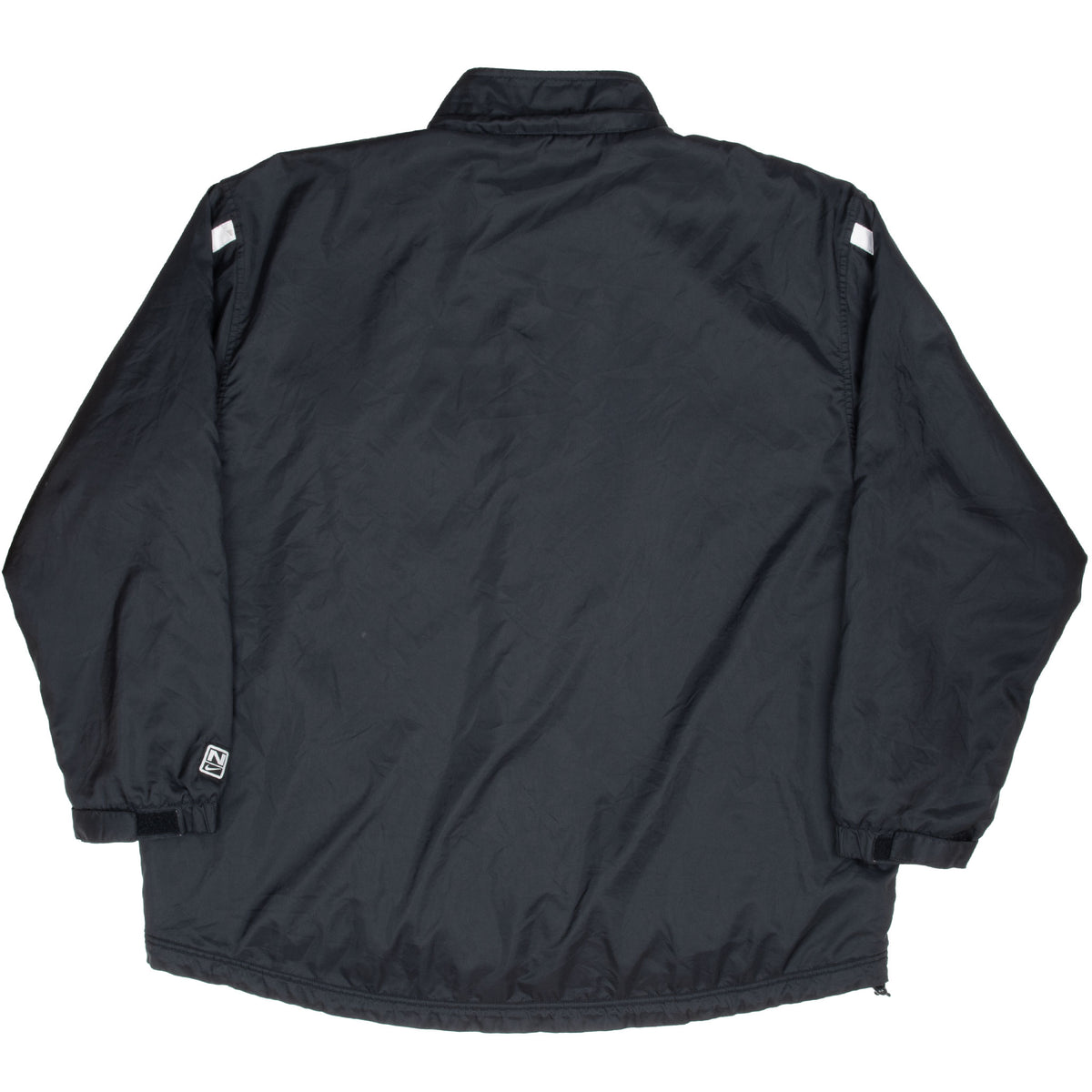 Back of black Nike windbreaker jacket with small logo patch near the cuff