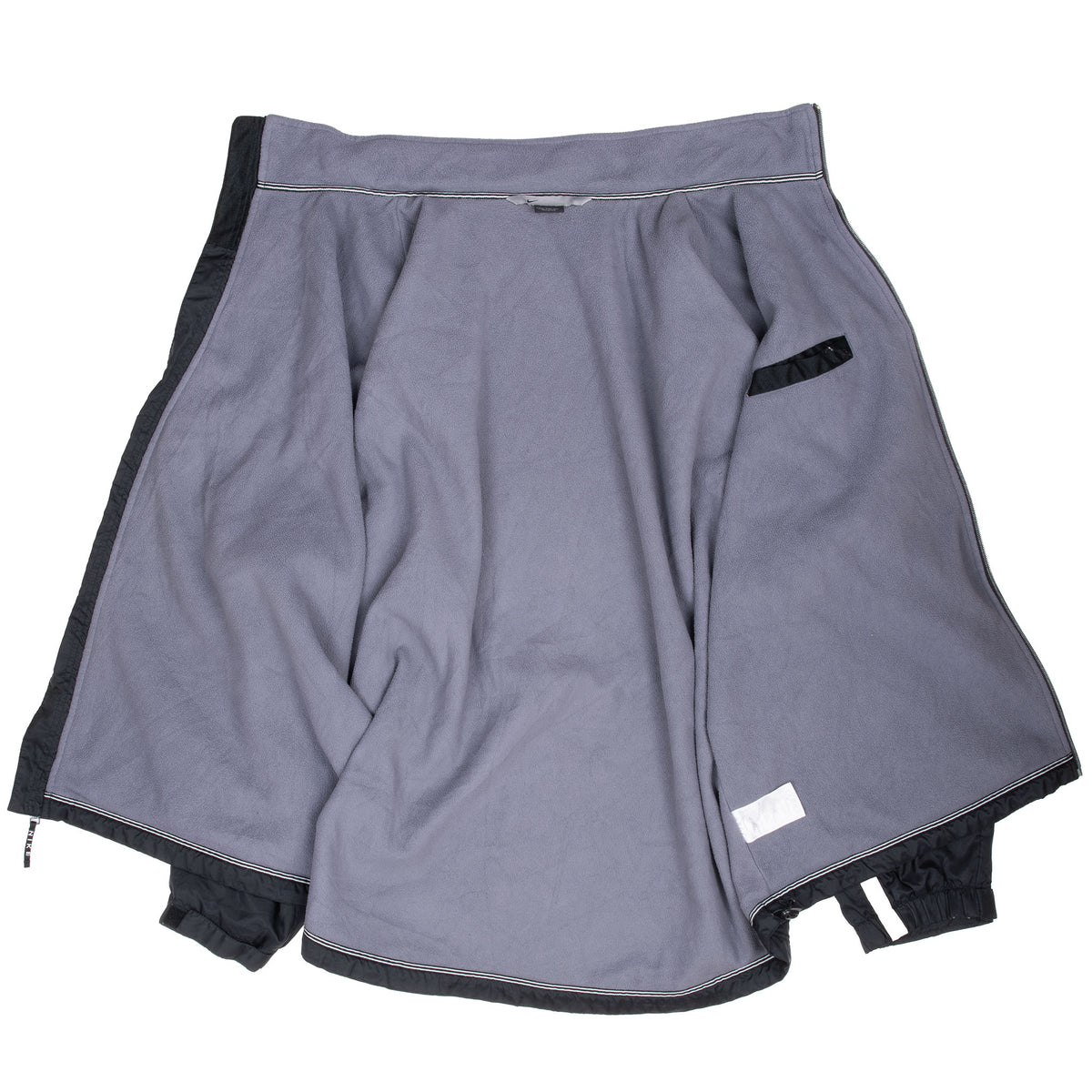 Open black Nike windbreaker showing gray fleece lining and interior pocket