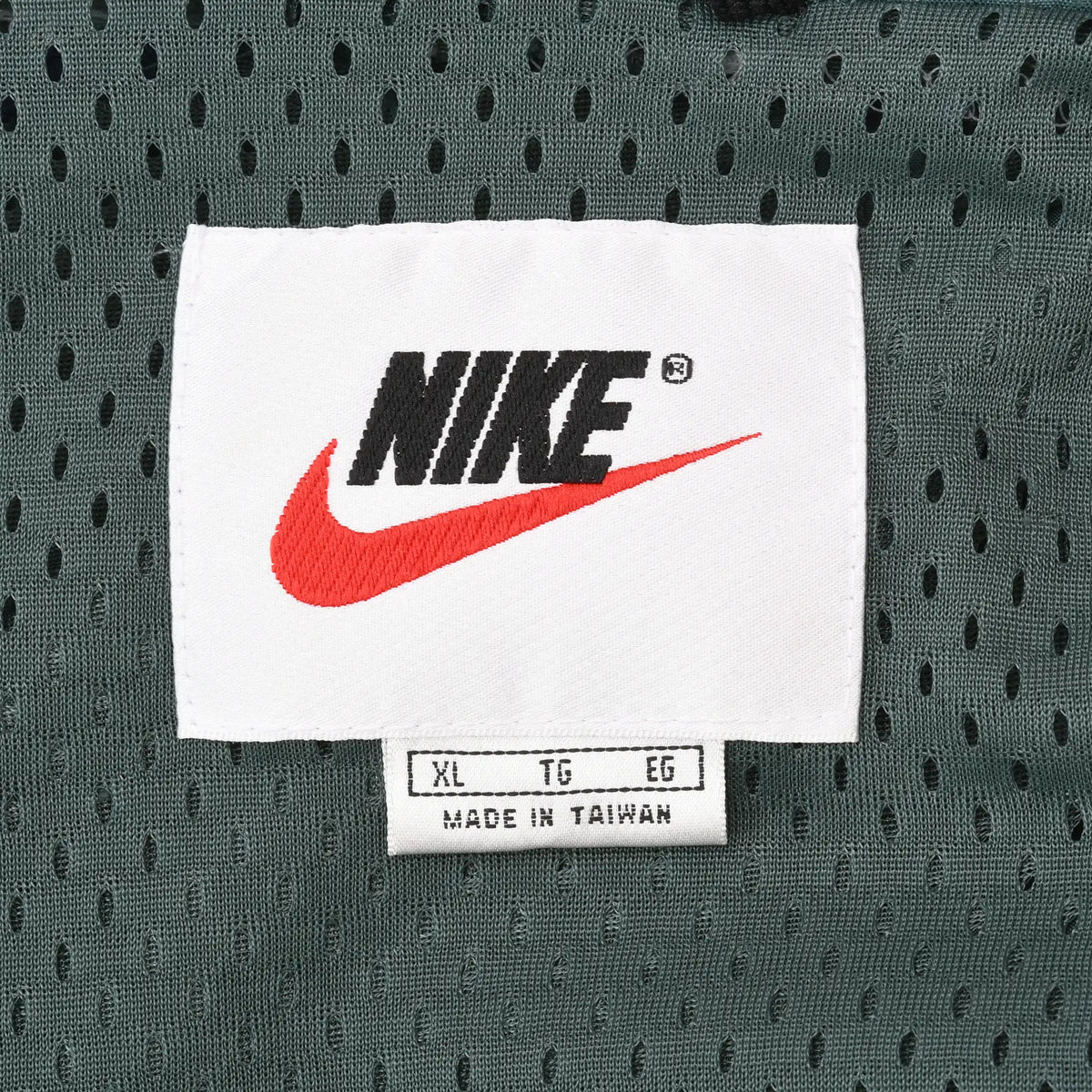 Nike neck label and XL size tag on green mesh lining