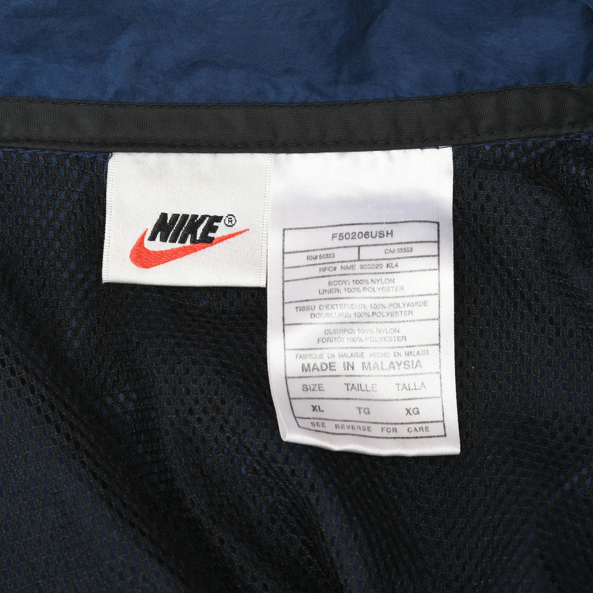 Close-up of interior Nike brand and size XL care labels