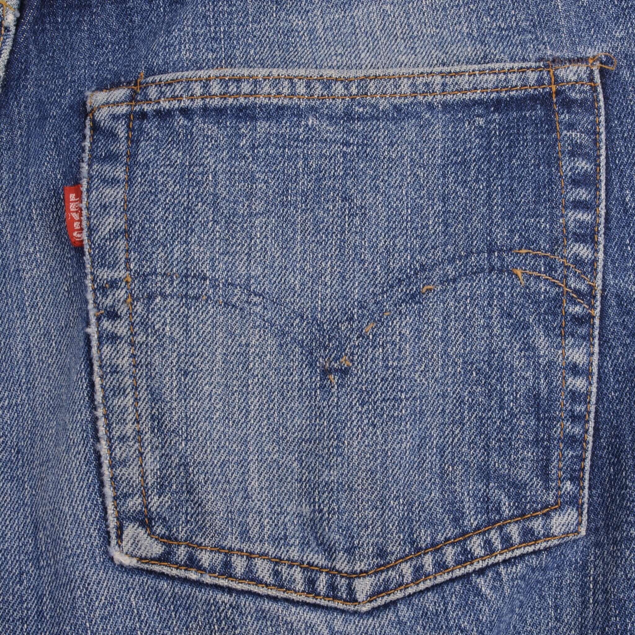 Beautiful Indigo Levis 501 Jeans with Redline and Big E 1970S Made in USA. AMAZING WASH with a medium blue wash, a nice contrast of light and medium blue with light whiskers. SIZE ON TAG 30X31 ACTUAL Size 29x28 Back Button #6
