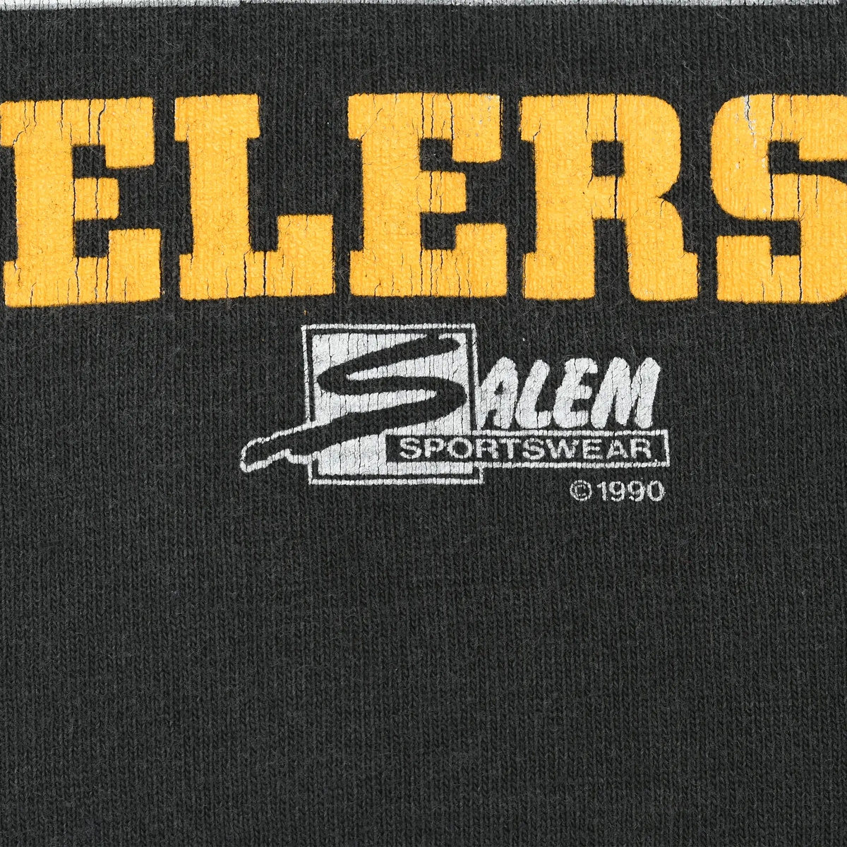 Close-up of yellow Steelers lettering and Salem Sportswear 1990 print