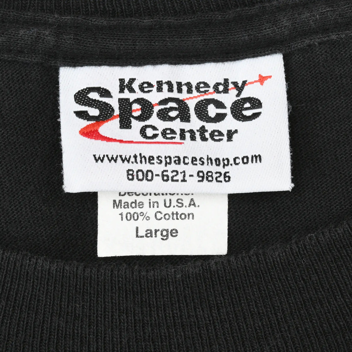 Kennedy Space Center neck label showing Made in U.S.A., 100% cotton, and size Large