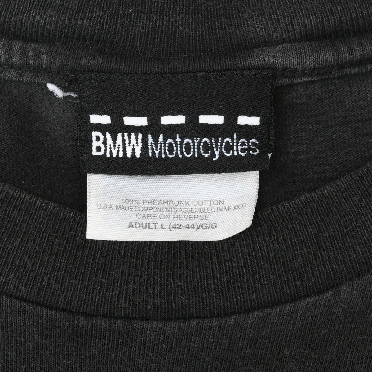 Close-up of BMW Motorcycles neck label on black T-shirt